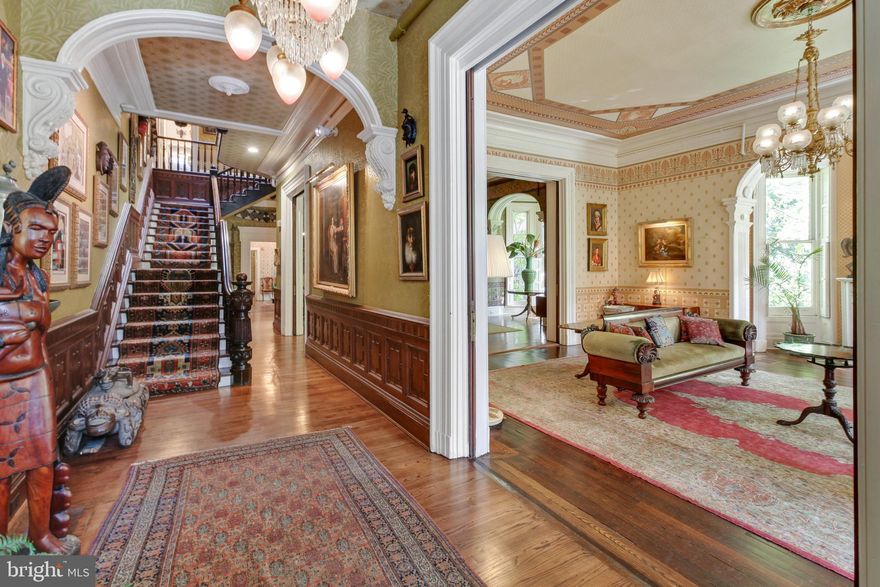 Magnificent and Grand, Rarely Available, 10 Bedroom Brick Home With 10 Parking Spaces and Ideally Located in Historic Mount Vernon.  Steeped in History, Located Within the Shadow of the Washington Monument and Nationally Recognized Fountained Parks, Beckons An Opportunity of a Lifetime!!!   
Inviting, Lavish, Impeccable, Extraordinary Architectural  Details, Fine Wallpapers, Huge Beautiful Kitchen, Mature Courtyard Garden......More Pictures Coming!!!... This Would Make a Wonderful Inn, Corporate Headquarters, Boutique Medical Facility!