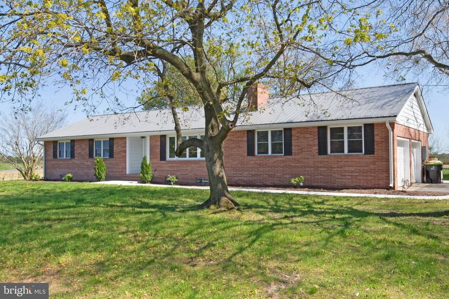 Spring and summer are just around the corner, and this stunning fully brick rancher is ready for its new owners! Completely rehabbed and move-in ready, this beautifully remodeled home features a full basement and a whole-house generator—offering comfort, security, and modern living just minutes from the Delaware Bay, where you can even catch the scent of the salt air.

Step inside to a spacious gathering area with luxury vinyl plank flooring and a cozy brick fireplace—perfect for relaxing or entertaining. The gourmet-style kitchen is a true showstopper with brand-new soft-close cabinetry, granite countertops, stainless steel appliances, pendant and recessed lighting, and a comfortable eat-in space. Sliding glass doors lead to a large rear porch, ideal for seasonal outdoor living and entertaining.

The primary suite offers new LVP flooring and a private bath featuring a tub/shower combo, double vanity, and updated lighting. Two nicely sized guest bedrooms, plus a versatile flex space perfect for a home office, den, or hobby room, provide plenty of living options. Additional upgrades include a brand-new half bath, a full guest bath with walk-in shower, and a full unfinished basement complete with a drainage system.

This home is loaded with practical upgrades including a two-car attached garage, whole-house generator, new standard septic system, new windows and doors, updated HVAC, and some new plumbing & wiring.  Outside, mature shade trees and low-maintenance landscaping complete the convenient setting.  Back yard is perfect for your seasonal garden. 

Ideally located just a short ride to Broadkill Beach or Primehook Beach and minutes to downtown Milton’s community events, farmers markets, restaurants, breweries, and unique shops—plus close proximity to Lewes and Rehoboth. Meticulously remodeled by Cutting Edge Construction, this exceptional home is truly turnkey and ready for its next owner to enjoy.