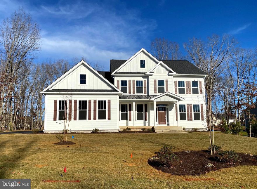 Brand New Ava Grace Model Home located in desirable Fawn Lake.  Wonderful Front Porch opens to the wide Foyer flooded with natural light and featuring gorgeous engineered hardwood flooring that carries through the majority of the main level.  The Foyer is flanked by a private office/study showcased by glass French doors on one side and a lovely formal Dining Room on the other.  Enjoy entertaining or special occasions in the perfect setting characterized with a wide entryway and handsome trim and chair railing.  A focal point of the two story Great Room is the fabulous soaring stone fireplace accented with floor to ceiling windows overlooking the rear yard.  A delightful cook's Kitchen features a combination of surface mounted and pendant lighting over the incredible quartz counters.   Cooking will be a breeze with state of the art stainless steel appliances to include a wall oven with air fryer feature.  Continuing the preparation or serving area, a spacious Butler's Pantry offers a tile backsplash, additional cabinet storage including a wine cooler and built-in wine rack.  Enjoy casual dining at the breakfast bar or dining space with access doors to the composite rear deck.  Retreat to the Main Level Primary Bedroom Suite, well appointed with two walk in closets and a fabulous Bath having separate vanities, a soaking tub and tiled shower.  Completing the Main Level is a convenient Laundry Room with utility sink and a nice half bath for guests.  A huge Loft area on the Upper Level offers an overlook to the Great Room below and endless use options for owners and guests.  Also on the Upper Level are three large Bedrooms.  A private en-suite on one side of the Loft is enhanced with a walk in closet.  Two other sizable Bedrooms share access to a full Bath with double vanity and separate bathing area.   Located on a .74 acre wooded lot, the modern farmhouse design provides tremendous curb appeal, a beautiful front yard to enjoy and an extended driveway that meets the three car oversized garage.