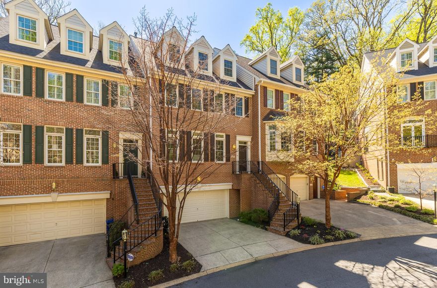 Welcome to 2170 21st Court North, an elegant residence perfectly positioned within Hillcrest—one of North Arlington’s most exclusive and picturesque townhome enclaves. Comprising just 33 distinguished homes across seven landscaped acres, Hillcrest is gracefully perched above Spout Run Parkway and the Potomac River, bordered by serene National Park Service land. The result is a refined sense of privacy and calm, all within moments of metropolitan Washington.

Blending timeless colonial architecture with a thoughtfully proportioned interior, this four-level home offers approximately 3,800 square feet of refined living space, including three bedrooms, three full baths, and two half baths.

Main Level
The main level welcomes you with a classic, connected layout ideal for sophisticated living and entertaining. The formal living room is bathed in natural light, highlighted by expansive windows and a double-sided gas fireplace that flows seamlessly into the dining room. The generously scaled kitchen, centered around a functional island, offers exceptional potential for personalization. A charming window seat and casual sitting area overlook the private rear terrace—perfect for al fresco dining and relaxation.

Upper Levels
The third floor hosts the primary suite, a tranquil retreat overlooking the rear gardens, featuring a sitting area, abundant wardrobe space, and a spa-inspired bath with dual vanities, soaking tub, and separate shower. A second en-suite bedroom with a private bath and the conveniently located laundry complete this level. The top floor offers a versatile finished space with a full bath—ideal for a guest suite, office, or studio.

Lower Level
The lower level is designed for comfort and functionality, featuring a spacious recreation room with custom built-in cabinetry, a powder room, and direct interior access to the oversized two-car garage. Additional open and enclosed storage adds practicality rarely seen in townhome living.

Location
A coveted address with unmatched convenience, Hillcrest is mere minutes from Courthouse, Clarendon, and Georgetown—offering effortless access to vibrant shopping, dining, and nightlife. Nearby parks and trails invite an active lifestyle just steps from your door, creating the perfect balance of natural serenity and sophisticated urban living. With proximity to major commuter routes including I‑66 and the George Washington Parkway, the best of Washington, DC, and Northern Virginia is truly within easy reach.