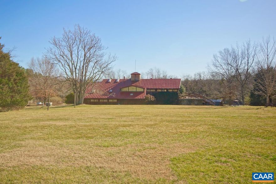 Nestled in the foothills of the Blue Ridge Mountains in historic Madison County Virginia,  25 minutes from Charlottesville, 90 from Richmond and 90 minutes from D.C.  Sevenoaks retreat center has 120 majestic acres with a mix of open space, mature hardwood forest,  evergreens, mountain views and bordered by the Rapidan River to the West.  The campus has seven buildings totaling 17,307 square feet including meeting space for up to 100 people, a variety of lodging accommodations for up to 60 people and dinning up to 80 people as well as office space for on site management.  Other amenities include, miles of nature trails, fire pit, organic vegetable garden, medicine wheel, pond with Koi and meditative sanctuary.  Suitable for a corporate retreat, spiritual retreat, school, hotel, camp, event center or a myriad of other possible uses.  Preservation easements protect the land with the Virginia Outdoor Foundation in perpetuity.  Additional development possible within the framework of the Open Space Easements.