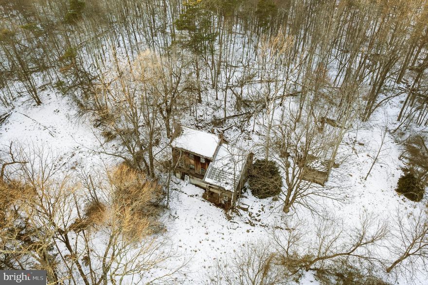 5.64 Acres on a private wooded lot, perfect for your future home! There is an existing structure on this lot that is not habitable. This lot shares a driveway entrance with 311 Jermikey Ct. Everything on the property conveys. The seller will not be removing any items.

311 Jermikey Court and 8 acre lot across the street also for sale.