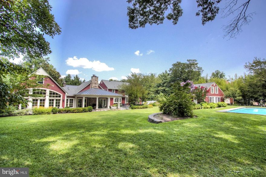 PRICE REDUCED!! The prettiest home in McLean! Set on close to 3 ACRES of privacy, this one of a kind property offers charm & character galore. A 200+ year old log cabin remains a part of the main house while fabulous new additions & renovations by BOWA in 2008 make this an entertainers dream home. Covered Porch with Stone FP, Pool, tennis court, guest house & 5 car garage spaces.