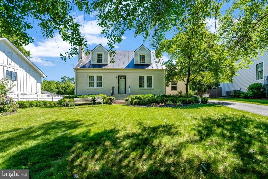 Beautiful, bright, and move-in ready Cape Cod, on a prime lot, in the heart of Mclean, sitting on a hill, and offering a beautiful view, in Broyhills Mclean Estates! Enjoy walkability to all Mclean and this wonderful community has to offer. The main level features a spacious open kitchen, with vaulted ceilings, skylights, abundant cabinets, pantry, a cooktop breakfast bar, barstool seating, granite counters, stainless steel appliances, and table space. Adjacent to the kitchen is a lovely dining room, a living/family room with gas fireplace, half bath, and rare main level bedroom/office, with French door access to rear yard. The upper level includes three bedrooms, generous closet space, built-ins, and a full bathroom. The fully finished basement is spacious and complete with family/rec room, bedroom/den, and full bathroom that includes a shower, soaking tub, and heated tile floors! Easy outdoor access from the basement walk-out, includes access to a separate, large, finished storage room. Plantation shutters, wood flooring, tile, and LVP, are installed throughout the home (no carpet). This premium lot sits level upon a hill, offering luscious landscaping, a fully fenced/flat backyard, patio, and open space, for everything from bbq's and gardening, to activities and sports. This home is perfect for entertaining friends and family, or relaxing with your favorite book, and beverage. Lovingly and meticulously cared for, there are plenty of updates throughout, including a new patio and brand new metal roof by Loudoun Valley Roofing Co.! Two driveways, stone parking pads, and plenty of open street parking, easily accommodate all vehicles. With a high Walkscore, this home enjoys proximity to downtown Mclean's grocery, retail, and restaurants, including Starbucks, Giant, Balducci's, J. Gilbert's, Mclean Racquet & Health, and Mclean Pilates. Easy access to Tysons Corner, Tysons Galleria, Langley, the Pentagon, Washington D.C., Dulles & Reagan Airports, all major commuter routes, and silver/orange line Metro stops.  This home will only be listed for sale for a limited time, so act soon! Also listed for rent. Welcome home!