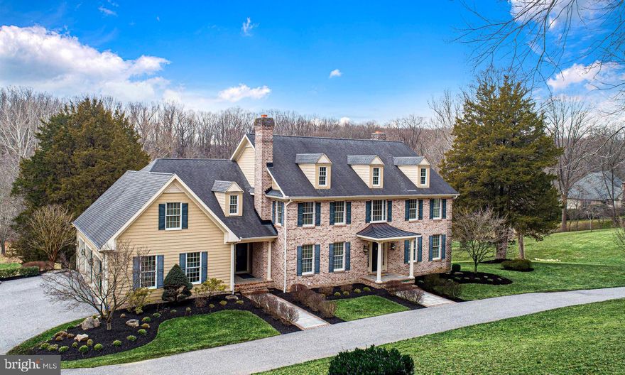 13604 Jarrettsville Pike is a stunning home located on a private gated lane, blending modern conveniences with serene countryside living. Set on over five sprawling acres, this four-bedroom, four-and-a-half-bath residence, crafted by Hagan and Hamilton, presents an opportunity to embrace space, comfort, and style. Recently updated with fresh paint, this meticulously maintained property is a blank canvas awaiting your personal touch. From the moment you arrive, you’ll be captivated by the manicured landscaping and impressive curb appeal. Inside, extensive millwork and hardwood floors infuse warmth and elegance into the generous living spaces. The open-concept kitchen and family room serve as the perfect gathering area, featuring a wall of picture windows and a cozy wood-burning fireplace. Enjoy high-end stainless steel appliances, granite countertops, freshly painted cabinetry, and a spacious breakfast area that leads to the covered rear porch—ideal for morning coffee or evening relaxation. A mudroom and laundry area are conveniently located adjacent to the kitchen, offering access to the garage and a second front entrance. The home’s dual staircases guide you to a thoughtfully designed second level, where the owner’s suite boasts dual walk-in closets and a spa-inspired bath. Three additional spacious bedrooms provide ample comfort, with one featuring a private bath while two share a well-appointed hall bath. The expansive finished lower level stands out, inspired by Baltimore’s historic Mount Washington Tavern. With stone accent walls, beadboard wainscoting, wood-pattern laminate flooring, and a full wet bar, this space is perfect for entertaining. The recreation area flows seamlessly to a stone patio, allowing you to move your gatherings outdoors during warmer months. Lush wooded surroundings offer ultimate relaxation and privacy by the built-in fire pit or a large area for play and exploration. Designed for luxurious yet comfortable living, this home eagerly awaits its next owners. Schedule your private tour today!