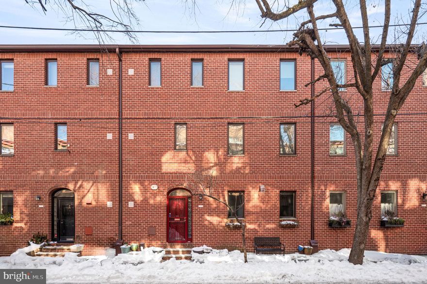 Set on a picturesque street just blocks from Rittenhouse Square, this fully renovated, light-filled home offers 3 bedrooms, an office, a den, and the rare convenience of garage parking. The open-concept first floor is designed for both everyday living and easy entertaining. The kitchen provides generous prep space and soft close cabinetry featuring a 6-burner Viking gas range, Thermador refrigerator/freezer, Bosch dishwasher, deep stainless-steel sink, Viking microwave, and a Sub-Zero refreshment refrigerator. A large island offers additional storage, while a built-in dining bench adds both character and practicality. This level also includes a powder room, a custom-fitted coat closet, and access to a comfortable patio, an inviting extension of the living space. A skylit staircase leads to the second and third floors. The second floor serves as a primary oasis, complete with an office, laundry, den, and a spacious en-suite bath featuring a tiled mosaic shower and a separate soaking tub. A large hall closet adds to the thoughtful storage on this level. The third floor offers two sun-filled bedrooms, including attic access for additional storage in the rear bedroom and an extra zoned air-conditioning system. A shared tiled hall bath features heated floors and a linen closet, along with two additional hall closets for added convenience.