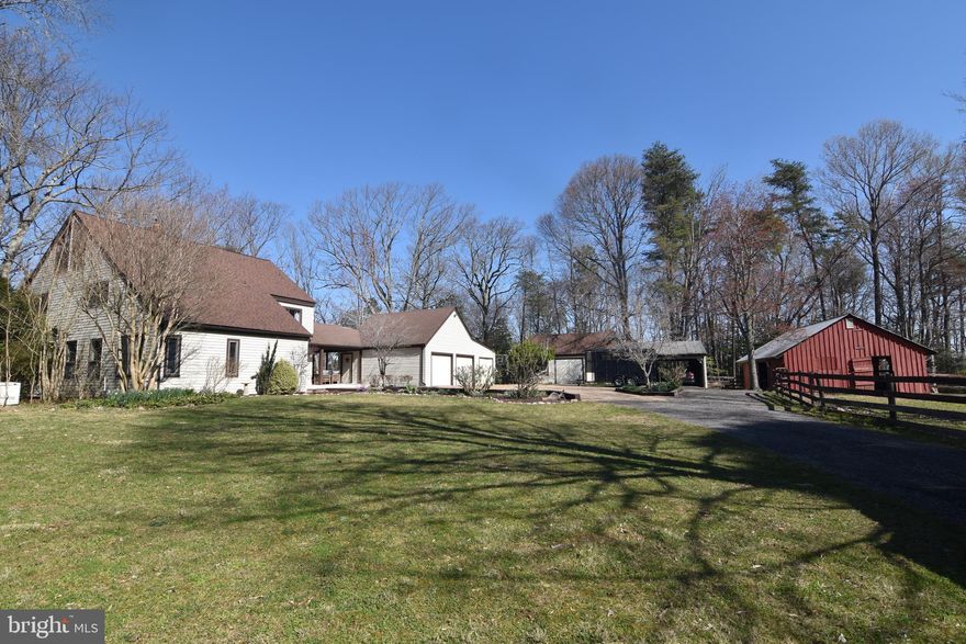 Beautiful 6 acre horse farm in water oriented neighborhood on the Chesapeake Bay.  House is  Post & Beam construction featuring wood floors, wood ceilings, exposed beams & open wooden staircases.  This 4 level home has 6 bedrooms & 4 full baths. Open floor plan.  Plenty of windows for natural light, no curtains needed!  Private lot backs to woods.  Fenced pastures have some electric fencing & wood fencing.  , 4 stall barn has tack room & hay loft. 2 stall run in shed w/ tack room, Both barns have water & electric.  Equipment shed.  Oversized garage.  Patio. Decks. Hot tub.  14K House Generator.  Private beach access.  Seller contingency on finding Home of Choice.