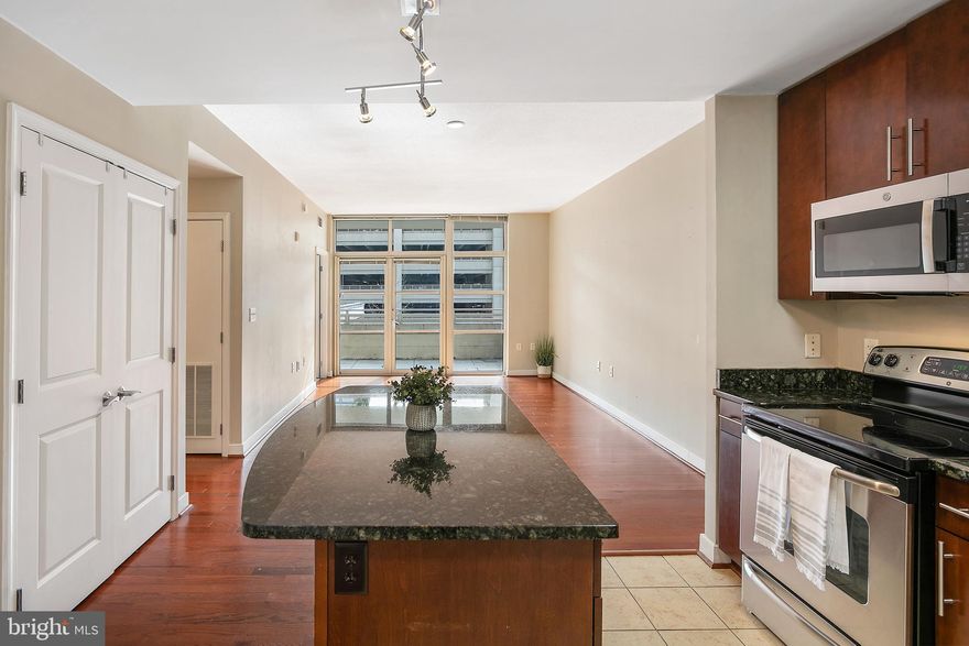 Welcome to this 2 bedroom, 1 bathroom condo at the National Harbor!

With its spacious balcony, modern amenities, and proximity to all that National Harbor has to offer, this condo is a must-see. Inside, you'll find a beautifully appointed, open concept design that creates a seamless flow from the kitchen to the living area, making it ideal for entertaining or simply enjoying everyday living. The den provides flexibility for your needs, whether it's a home office, guest room, or additional living space. Large windows bathe the condo in natural light, creating a warm and inviting atmosphere throughout the day. Step outside onto your 126 sqft private balcony; positioned on the opposite side of the hustle and bustle making it a quiet place to relax. Whether you're enjoying your morning coffee or unwinding after a long day, this peaceful oasis is the perfect place to decompress. 

Never worry about parking with two included garage parking spots, ensuring your vehicles are always secure and protected from the elements. This condo is ideally located near the airport, public transit, and major highways, making commuting a breeze. You'll also appreciate the convenience of walking paths around the water, which can lead you over the bridge into Alexandria. 

The water taxi from National Harbor to Old Town offers an exciting way to explore nearby historic sites. Enjoy the affordability of condo living without sacrificing any of the perks. Residents may also benefit from exclusive discounts at shops and restaurants throughout National Harbor – a perk worth confirming upon move-in. When events are held at the harbor, you'll have priority access to private roads, ensuring you can come and go without any hassle or traffic delays. 

 Schedule a viewing today and experience the best that waterfront living has to offer!