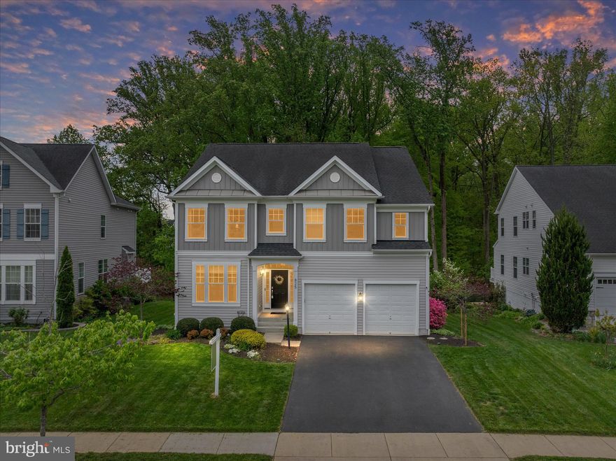 Welcome to this stunning, light-filled home nestled in the highly sought-after Wilson’s Grove community. Built in 2014 but maintained with such care it shows like brand new, this home perfectly blends sophisticated formal spaces with a warm, open-concept heart. Upon entry, you are greeted by an elegant formal living room and dining room that flow seamlessly into the main living area. The chef’s kitchen is a true showstopper, featuring quartz countertops, a large central island, stainless steel appliances, a double wall oven and a stunning custom pantry offering superior organization. An adjacent sunroom off the kitchen is currently utilized as a bright dining area. The expansive family room, centered around a cozy gas fireplace, provides the perfect backdrop for gatherings. The main floor is rounded out by a powder room and functional mudroom off the garage ensures the home remains organized and clutter-free. 

The second floor is designed for comfort and convenience. The Primary Suite is a sprawling retreat with space for a sitting area, "his and hers" walk-in closets, and a spa-like bath featuring a dual vanity, soaking tub, and walk-in shower. Three generously sized secondary bedrooms can be found down the hall, each featuring its own walk-in closet. A hall bath and beautifully updated laundry room with a dedicated work sink complete the top floor. 

The massive basement has been recently refreshed with brand-new LVP flooring, fresh paint, and custom shelving. This is the perfect space for entertaining or a movie night in! It includes an additional bedroom and full bath—ideal for guests. 

The backyard is a true showstopper and a private paradise. The large backyard backs to lush woods and features a professional built-in outdoor kitchen, an expansive patio with ample seating, and a hot tub (conveys with the home!) for ultimate relaxation.

Enjoy all the amenities that Wilsons Grove has to offer including a community pool, tennis courts, playground, basketball court, walking trails, clubhouse and fitness center. Just minutes from Waugh Chapel Town Center renowned for its many shopping, dining and entertainment options and close to commuter routes, this location can't be beat. This is the turnkey masterpiece you’ve been waiting for. Welcome home.

UPDATES INCLUDE: New Patio (2021), Deck (2025),  Hot tub (2021), Outdoor speakers (2021), Custom Pantry (2024), Laundry Room Update (2023), New Washer/ Dryer (2025), Sump Pump (2024), New Basement Floors (2026), Carpet (2026), Fresh Paint (2026)