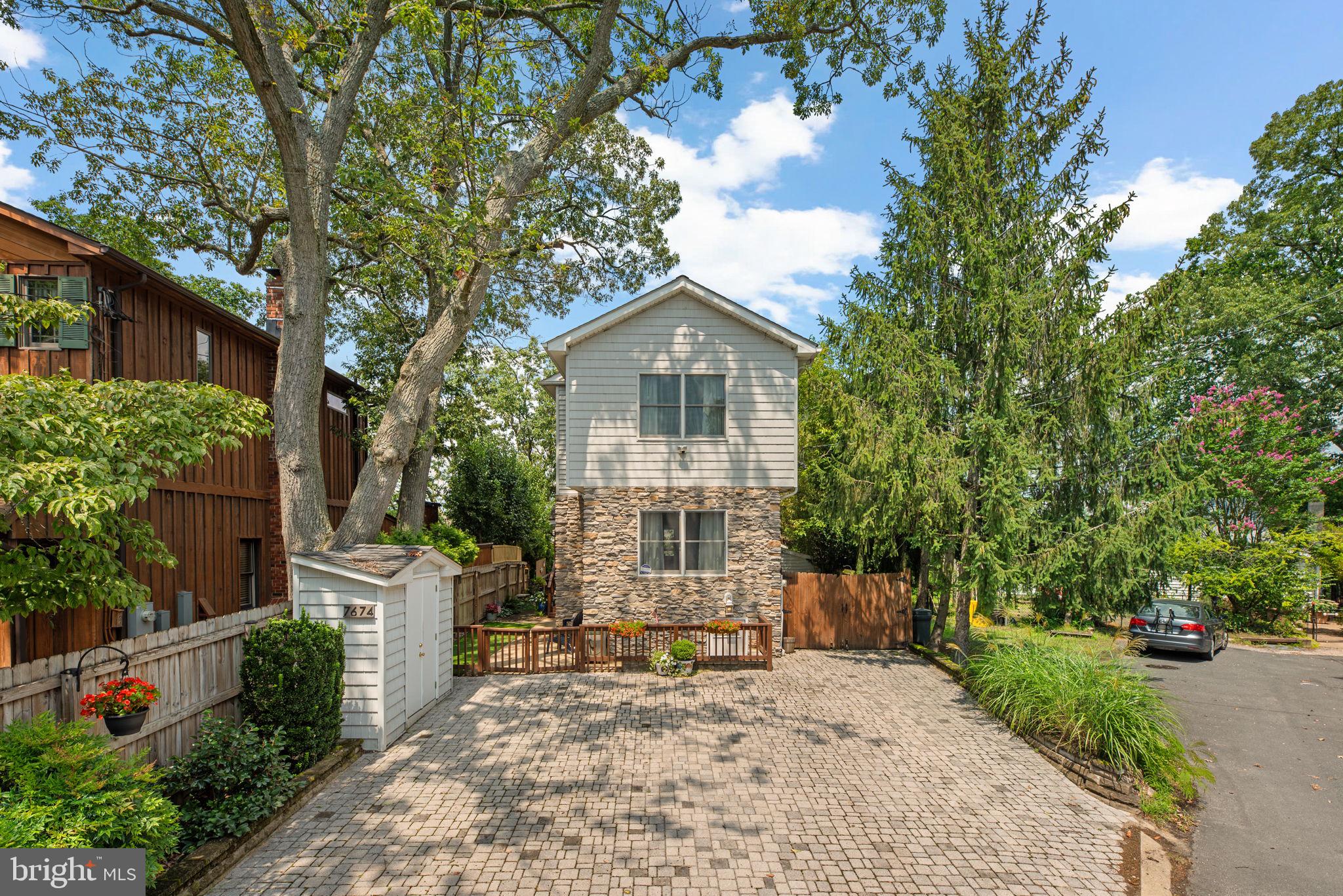 Beautifully remodeled, this stunning waterfront Colonial in sought-after Green Haven offers direct navigable access to Stoney Creek and breathtaking views from nearly every level. Tucked along the shoreline, the home presents an exceptional opportunity for water lovers with private multiple-slip docking and an inviting outdoor setting that embraces relaxation.
The home makes a striking first impression with a large front driveway, manicured landscaping, and gorgeous curb appeal enhanced by stone accents. Inside, the light-filled living room features rich hardwood flooring and a cozy pellet stove. The eat-in kitchen is both vibrant and functional, showcasing blue cabinetry, granite countertops, a stone backsplash, stainless steel appliances, a pantry, and an island with bar seating. A cozy breakfast nook opens seamlessly into the spacious family room, where an accent wall, expansive sliding glass doors, a convenient powder room, and sweeping water views create a truly special space. Also on the main level is a bedroom with a full bathroom nearby, ideal for guests or multigenerational living.
Upstairs, the luxurious primary suite is a true retreat, featuring soaring cathedral ceilings, dual ceiling fans, a stacked stone gas fireplace, and a private balcony with water views. The en suite bath includes a corner jetted soaking tub, a separate glass-enclosed shower, a dual-sink vanity, a skylight, and dual access from the hallway for added convenience. A custom walk-in closet with built-in organization completes the suite. An additional spacious bedroom and a laundry area in the hallway round out the upper level. The fully finished lower level adds even more flexible living space, including a large recreation room with luxury vinyl tile flooring, an accent wall, and walk-out access to the exterior. There's also a sitting/foyer with a full bathroom and a bonus room with its own walk-out access—ideal as an office, studio, or guest space.
Step outside to discover the ultimate waterfront lifestyle. A tiered deck with a pergola and built-in bar area offers the perfect setting for entertaining, while a side patio wraps around to the front driveway. Beautifully maintained decking and retaining walls thoughtfully constructed in 2022, enhance both the aesthetics and function of the outdoor space. Follow the steps to the lower deck and private dock, complete with multiple boat slips. With deep water access—measuring approximately 8 feet at low tide from the top of the pier—even large boats can easily navigate the waterways right to the property, offering seamless access to Stoney Creek and the open water beyond.