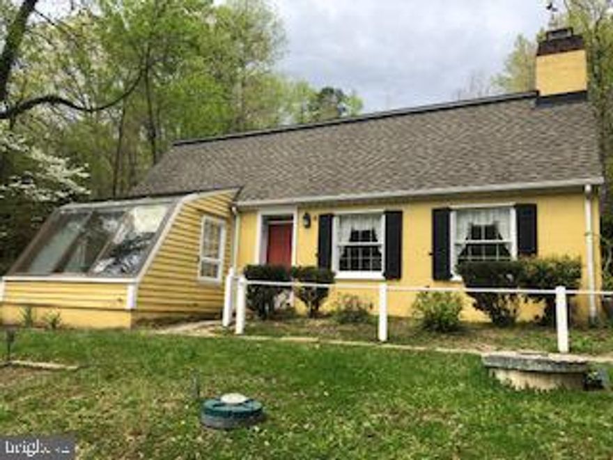 Very cute home on the lake.  Hard wood and tile floors,  Dock in the front yard, Great view.  Fireplace, custon built ins  around the fireplace