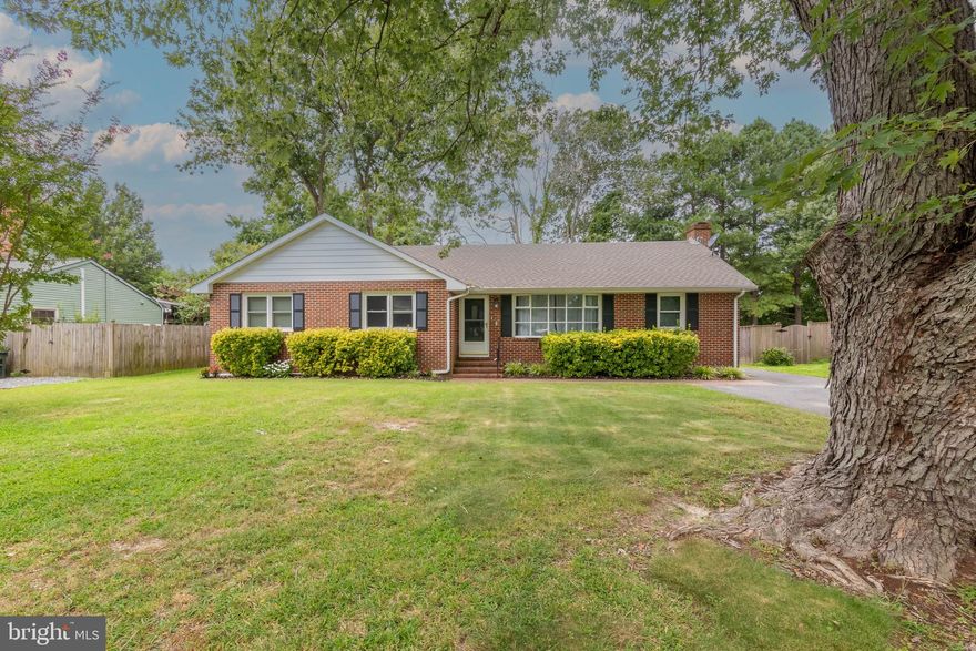 Situated on a lot that backs to trees is this lovely brick, ranch style home with three bedrooms and two baths.  The home features many 2021 upgrades including beautiful new hardwood floors, new kitchen and laundry appliances, new 30-year architectural shingled roof, and encapsulated crawl space with new sump pump. Additional highlights include wood-burning fireplace in the family room, formal living and dining areas, and a massive sunroom that leads to an ample sized deck.