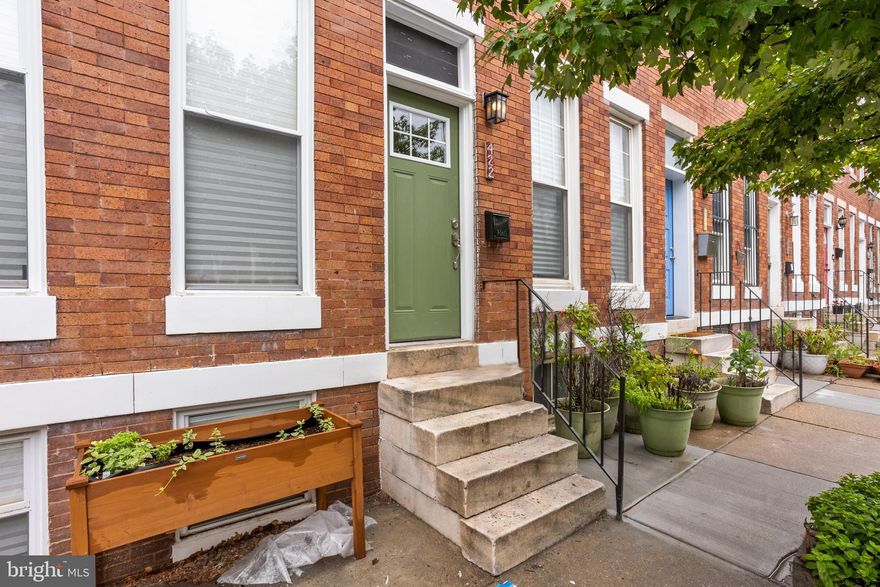 Newly renovated Baltimore Row house on beautiful Whitridge Row.  This brick, tree lined one way street offers a quiet, inviting  environment to call home. There are three bedrooms, and two and a half baths.  The main level boasts luxury vinyl flooring, tall ceilings, some exposed brick, the original staircase and a lot of designer touches.  Its tall White and Blue kitchen cabinets are enhanced with white Quartz  counters, stainless steel appliances and a peninsula between the  open concept kitchen and dining area. The custom baths feature exceptional tile work and upgraded fixtures. The primary ensuite bedroom is bright and spacious. Enjoy the fenced back yard perfect for entertaining and gardening. There are some attractive first time buyer  grants available. This includes the JHU Live Where you work grant of $17,000  available to full time JHU employees. This community is most convenient to everything including the Hopkins Shuttle.  The Washer and Dryer are on back order. They should be installed prior to your home inspection.  This community is part of the Charles Village Special Benefits District.