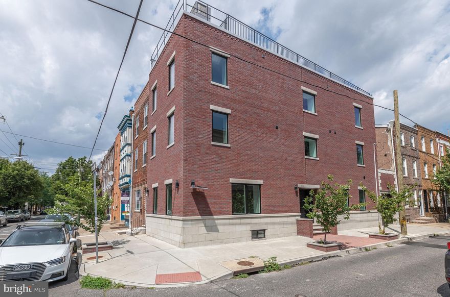Spectacular  luxury townhouse with parking/Garage.in the heart of Passyunk Square. We have 3400 square feet +/- of spacious, sundrenched top of the line living space. This massive, fully appointed, upscale home has been completely and thoughtfully designed and completed for those who require every amenity, and is situated in the hottest neighborhood in Philadelphia. Enter from Annin Street through a triple latched door into enormous living and dining spaces. Fully finished with new hardwood flooring and recessed LED lighting throughout. A 75 inch flat screen is mounted above the hearth of custom built electrically fired fireplace. Proceed into our fully and tastefully equipped gourmet kitchen built for those who like to entertain. Every aspect of modern, upscale city living has been included for your culinary needs. More cabinets than you'll ever use, and every appliance, to include an under counter wine refrigerator. From this point upward, moving up open, extra-wide stairs we come to the second floor that boasts two full bedrooms, each with its own full bath and extra-large closets. The front bedroom has a sauna and shower, and the rear features a full tub. Again, fully appointed. From the rear bedroom, step out onto your large outdoor deck to enjoy mild nights. Again, full hardwood flooring with recessed LED lighting, and each bedroom is equipped with a large, remotely controlled ceiling fan for your comfort. The laundry has been thoughtfully placed on this level off of the open landing to make laundering convenient. Proceed further up to the third floor where you will find two more full bedrooms with huge closets, each with its own full bath with showers. These spaces have been appointed and equipped as those on the second level. Finally, up to the roof deck that spans the entire footprint of the house itself, with wonderful views of the center city skyline to the near north, the Benjamin Franklin Bridge to the northeast., and a 360 degree view of the entire city. Lastly, the lower level has been fully finished for family activities. You have a huge storage room, along with a half bathroom and mechanical room. Your environment is looked after by two zones of gas fired central heating and air conditioning. (lower level/first) and (second and third floors). You can walk to the shopping center with supermarket a block away, and the many restaurants and other venues along Passyunk Avenue. A huge city block sized park with recreation center and dog run facilities that is very popular with the neighborhood is one block to the south. Center city and all that city life has to offer is paces away, and accessible by the subway station two blocks to the west. A one car garage that can accommodate a full sized SUV is attached, with remote controlled door. The brick pavement features a built in heat system to keep your entry area safe and free of ice and snow. All systems and mechanical features are brand ne