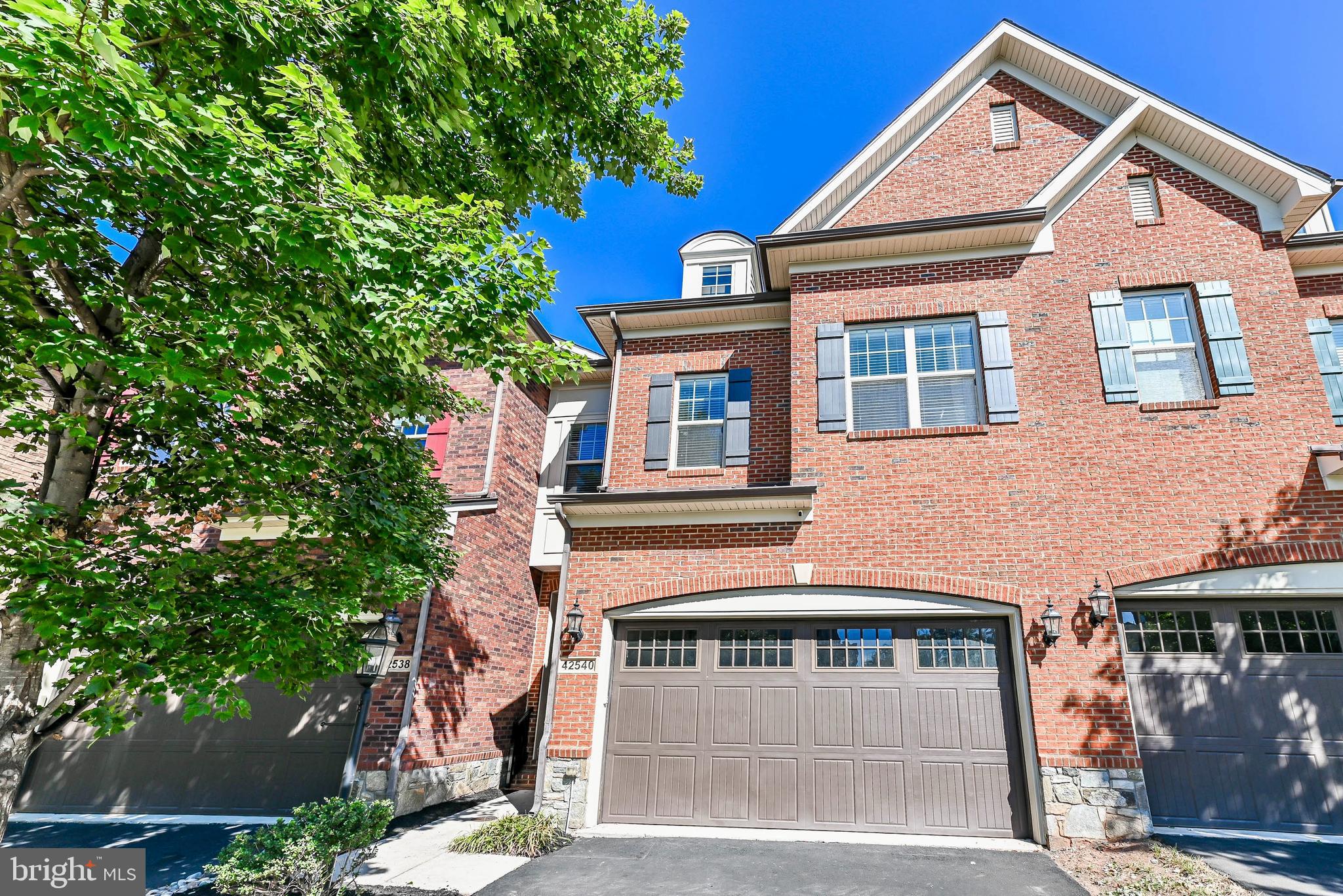 Beautiful townhome nestled in the highly sought after Brambleton community! This charming colonial townhome offers modern living with timeless elegance, making it an ideal place to call home. Elegant hardwood floors throughout main level and upper level. Beautiful gourmet kitchen with maple cabinets, granite countertops, stainless steel appliances and ceramic tile backsplash. Spacious family room with cozy gas fireplace and plenty of natural light streaming through large windows. The primary bedroom offers a serene retreat with a spacious sitting area, oversized windows and a walkout terrace. The primary bathroom includes a soaking tub, glass-enclosed walk-in shower and tasteful tile finishes. The fully finished walkout basement has a huge game room and media room. Brand new roof, EV Charging Station and Dog Washing Station. Brambleton residents enjoy access to a world-class suite of amenities, including 5 resort-style pools, over 250 acres of green space, an 18-mile network of trails, countless sports courts, parks and lakes. Verizon FiOS TV and High-Speed internet are included with the HOA fee. Just minutes from the Dulles Toll Road and Ashburn Silver Line Metro station. Don't miss this opportunity-scheduled a showing today.