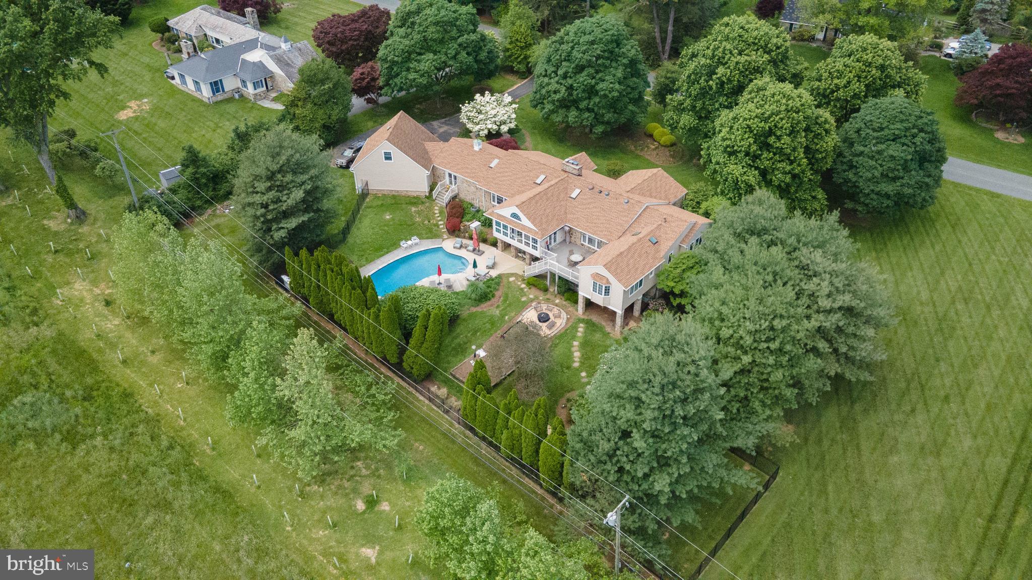 Nestled in the highly sought-after Hampton neighborhood of Towson, this stunning stone rancher is the perfect blend of elegance, comfort, and privacy. Situated on a sprawling 1.5-acre lot—including an additional parcel that conveys with the sale—this exceptional property backs to the scenic and serene Hampton National Historic Site, offering unparalleled views and tranquility.
Step inside to discover a thoughtfully updated home boasting vaulted ceilings in both the living room and sunroom, three cozy fireplaces, and gleaming refinished hardwood floors throughout the main level. Each of the main-level bedrooms features its own private ensuite bathroom, ensuring privacy and comfort for all.
The remodeled primary suite includes a luxurious bathroom with heated flooring, creating a spa-like retreat. Enjoy peace of mind with major updates already complete: a five-year-old roof, a two-year-old HVAC system, new insulation, and a recently upgraded in-ground pool, ideal for summer gatherings.
The fully finished lower level offers endless possibilities with an exercise room, two additional bedrooms, a full second kitchen, and generous living space—perfect for entertaining, multi-generational living, or an in-law suite.
From the light-filled sunroom overlooking the breathtaking backyard to the thoughtful finishes throughout, 605 Saint Francis Road is a rare gem in one of Towson's most desirable communities.