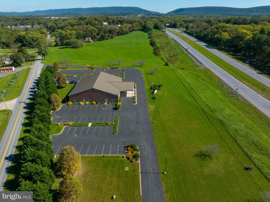 For Sale: Established Funeral Home in Harpers Ferry, WV - Eackles- Spencer and Norton Funeral Home. They have served the area since 1918.  They are licensed in WV, MD and VA.

Location: Prime commercial location along US Route 340, Harpers Ferry, WV. High Traffic Flow.
Zoned: Residential-Light Industrial-Commercial  -broadest zoning available in Jefferson County 

Property Details:
  Road Frontage  Property enjoys controlled access frontage on a primary highway US Route 340  with substantial accessible frontage on public secondary highway with excellent visibility

Business: Established and successful funeral home with an excellent reputation.  Business included in sale
Main Building:
Size: 8,944 sq. ft.
Condition: Well-maintained with no deferred maintenance.
Versatility: Currently configured for funeral home use but can easily be adapted for:
Church
Event hall
Medical center
School
Offices      
General commercial 
Parking: Asphalt paved open surface parking lot for 100 cars surround main building 
Acreage   5.5137 +-   Additional 7.04 acres  available fronts Rt.340 
Taxes provided are based on the 12+ acre parcel. 
All furnishings included with the exception of all art work

Additional  Buildings included in sale 
 71 Panama  Street and Zorger St.  Town of Bolivar Harpers Ferry .38 acres    B-1 zoning  permits a wide array of both commercial and residential use.  Mixed use. Public Water and Sewer 
 Includes two detached buildings: warehouse  building/storage, 5,402 sq.ft ; second building apartment garage;   garage on first floor with  second floor apartment, rentable area 1,248 sq. ft .   Apartment is rented provides monthly income.  Could be office space. There is an easement right of way from the back of the warehouse to Madison Street.

Investment Opportunity:
This  Halltown Road property  offers excellent functional utility and versatility for various commercial applications. Whether you're looking to continue the funeral service, convert it to another use, or invest in a growing community, this property is a valuable asset.
Contact Information:
For more details or to schedule a viewing, please contact agents. Don’t miss out on this unique opportunity. Outstanding property.  Outstanding opportunity.

View Video tour.  Floor plans of Main building and 71 Panama Street in Documents