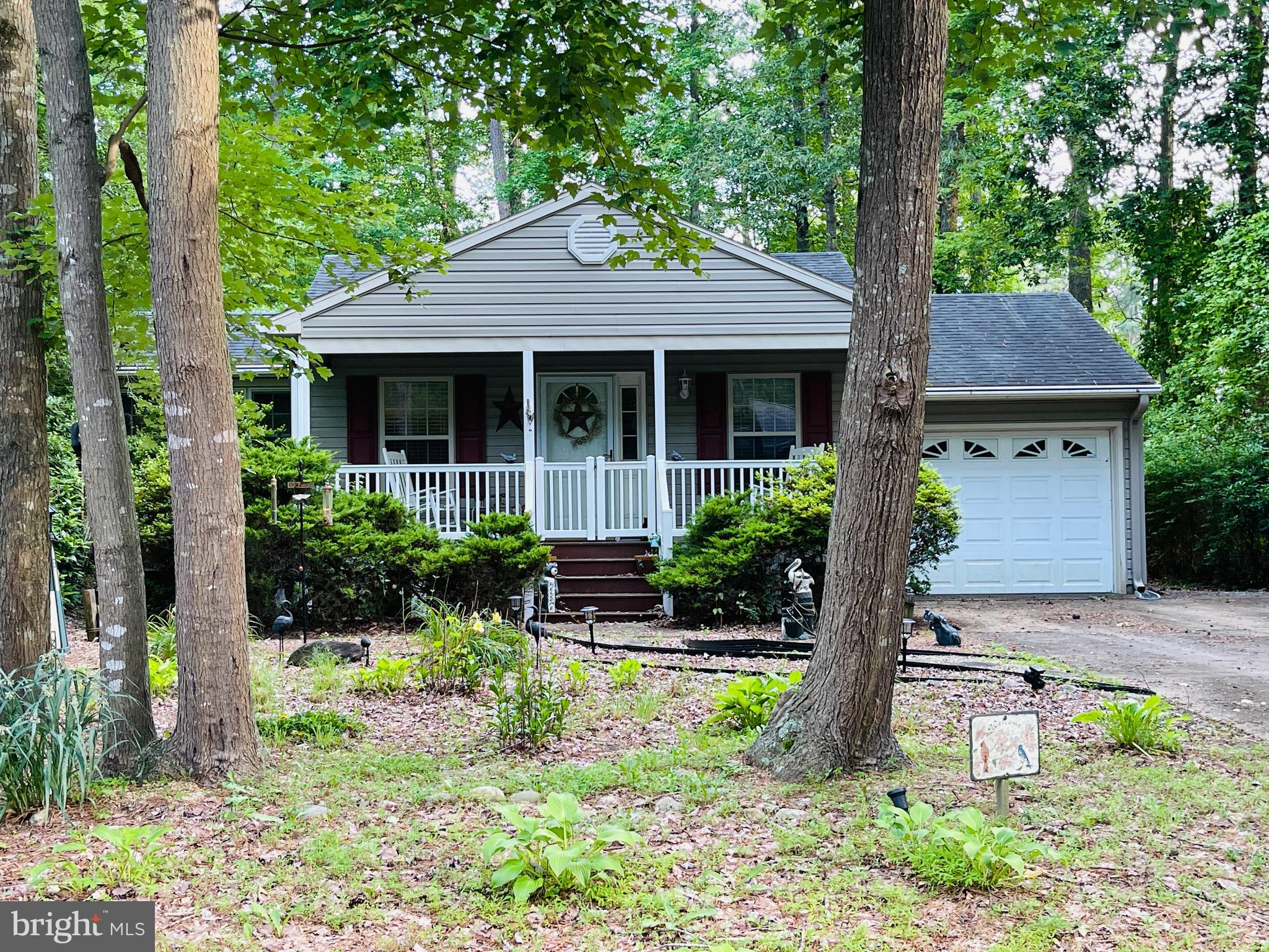 Nestled in the highly sought-after Ocean Pines community, Charming, move‑in ready ranch-style home built in 1993, offering a thoughtfully designed living space with three bedrooms, two full baths, and a welcoming front porch that sets a warm tone from the moment you arrive. Beautiful kitchen and baths, along with newer appliances, roof, and HVAC installed in 2012, deliver a turnkey living experience, while the spacious great room delights with cathedral ceilings, hardwood flooring in the living and dining areas, and a cozy gas fireplace framed by a custom mantle—perfect for gatherings or quiet evenings at home. The primary suite boasts private deck access, offering serene views of the fully fenced and beautifully landscaped yard, an outdoor oasis ideal for morning coffee or evening BBQs alongside family and friends. Functional touches like a 3-season room, expansive deck, pull-down attic, attached and detached sheds, one-car garage, and ample parking—including space for boats or trailers—underscore this property’s blend of convenience and thoughtful storage solutions. Situated on a spacious .22 acre lot in a vibrant community that includes a golf course, five pools (indoor and outdoor), paddle tennis, parks, playgrounds, a clubhouse, and beach facilities just five miles away in Ocean City, this home offers not just a house, but an enriched coastal lifestyle which represents both a wise investment and a welcoming place to call home.