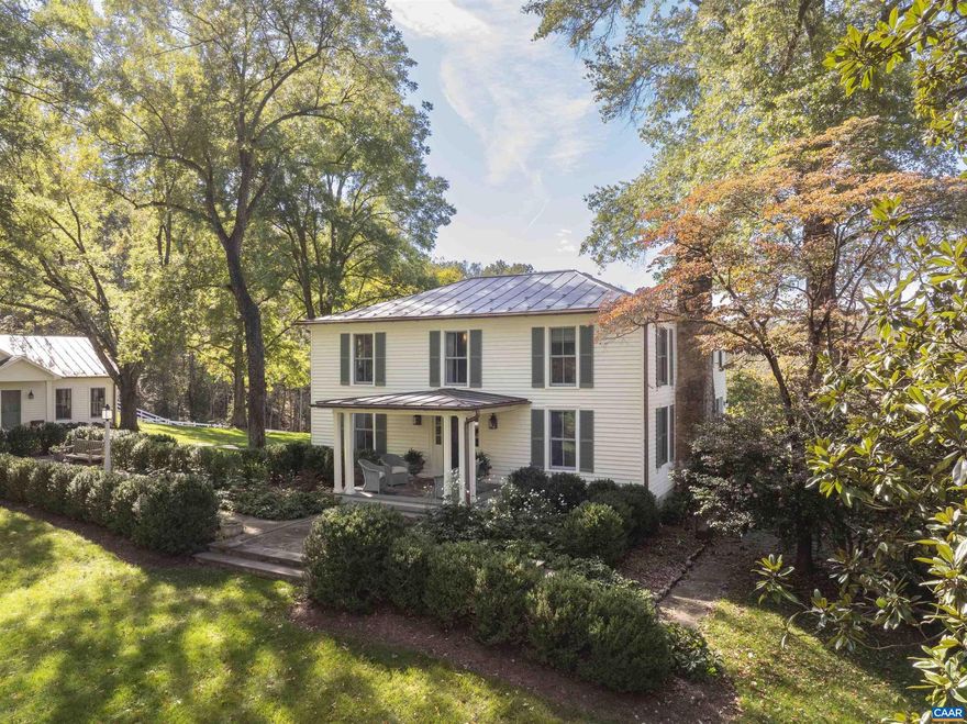 Private estate minutes from Charlottesville and the University with wonderful Blue Ridge views. The 1888 traditional farm house has been completely renovated and decorated by well known interior decorator, yet retains the charm and woodwork of the original house. The main house includes 3 bedrooms with private baths, large kitchen with high end appliances, family room, large living room with fireplace. Other improvements include a new guest / pool house, pool, and 2 car detached garage with a charming office. Also includes a small tenant / manager cottage. All improvements are beautifully situated on the 21 acres with complete privacy.,Fireplace in Family Room,Fireplace in Living Room