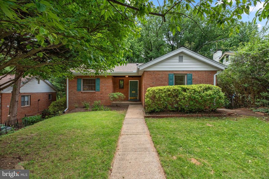 Treetop Views, Parkside Tranquility & Urban Convenience — Welcome to 124 Fleetwood Terrace
Nestled on a quiet hill and backing directly to the lush trails of Sligo Creek Park, this beautifully updated 5-bedroom, 2-bath brick rambler offers the rare combination of natural serenity and city accessibility—all just a short stroll from downtown Silver Spring and the Metro.
With over 2,700 square feet of stylish, light-filled living space, this home is designed for modern comfort and effortless entertaining. Step into a welcoming foyer that opens to breathtaking treetop views, setting the tone for a home that feels like a retreat. The expansive deck off the main living area is the perfect spot for morning coffee, evening gatherings, or simply soaking in the sights and sounds of nature.
Inside, hardwood floors grace the open-concept main level, where a light-drenched living room with a wood-burning fireplace flows seamlessly into a dining area with custom built-ins. The kitchen features sleek quartz countertops, a breakfast bar peninsula, brand-new stainless steel appliances, and ample storage—ideal for casual meals or hosting a crowd.
Downstairs, the fully finished walkout lower level adds incredible flexibility with new luxury vinyl plank flooring, a wet bar with quartz counters and mini-fridge, a spacious family room with built-ins, and two versatile bonus rooms—ideal as offices, guest rooms, or additional bedrooms. One opens through French doors to a secluded patio surrounded by parkland, making it a perfect work-from-home sanctuary or private guest suite.
Whether you’re entertaining indoors, relaxing outside, or heading into the city, 124 Fleetwood Terrace offers a lifestyle that’s both vibrant and peaceful. With the future Purple Line close by and Silver Spring’s shops, restaurants, and cultural venues just minutes away, this is a rare opportunity to enjoy the best of both worlds—nature and neighborhood.
Don’t miss this one-of-a-kind home in one of Silver Spring’s most coveted, park-side locations.