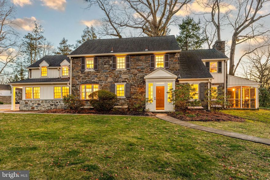 Gracious, turn-key 1930s stone colonial in walkable North Wynnewood location. This home radiates elegant Old World charm while boasting the floor plan and finishes appealing to the most discerning Buyer. Enter through the classic vestibule and enjoy the elegant archways, original random width hardwood floors, crown molding, deep window sills, recessed radiators and more charming detail at every turn. The center hall opens to a large living room with fireplace and overlooks the flat, fully fenced back yard. The living room leads to a charming screened-in side porch. A study, also off the center hall, is finished with built-in shelves and cabinetry. The dining room is large enough to host the whole family and overlooks the backyard with oversized windows. A renovated, eat-in kitchen with island and stainless steel appliances opens to a cozy family room, making this the gathering hub for the whole family. A mudroom off the driveway allows you to tuck everything in order before entering the family-room. A laundry room with exposed stone wall and a powder room with slate floors finish off the first floor. Upstairs a large primary suite is tucked apart for privacy. The primary bedroom features a large carrara marble bathroom with double vanity sink, tile shower and deep Kohler jetted soaking tub. A large lounge area includes ample closets and vanity. The primary bedroom suite is finished with a fireplace. Beautiful hardwood floors continue throughout the second floor. Two of the additional bedrooms share a hall bath with frameless glass door and basket weave tile. A fourth bedroom has an ensuite full bathroom and connects via back staircase to the kitchen. Deep closets in each of the rooms provide ample space for storage and organization. The finished basement has a second half bathroom and offers plenty of additional recreational space. Perched up on the lot, the home’s beautiful street presence is complemented by landscaping, flagstone patio, walkway and steps. The detached two car garage was completed by Gardner Fox and includes extra space (enough for even a small gym) as well as its own heat and A/C unit. The flat backyard is fully fenced. Award-winning Lower Merion School District with a short walk to Lower Merion High School. Extremely centrally located, less than a mile to Whole Foods, Wynnewood Train Station, Suburban Square and Ardmore Train Station. Commuters dream with easy access to roadways and train stations.