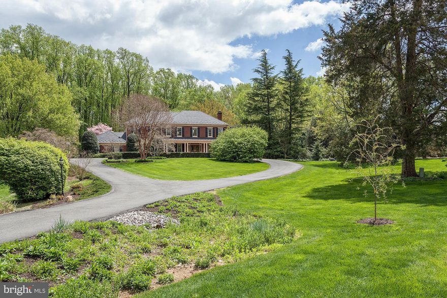 Stately Manor home sited on 2 beautiful lushly landscaped acres. Spectacular vistas * A huge porch spans the front of the house. Over 7,000 SF of living including a two story foyer & great room * Spacious master suite * Expansive lower level *  Sunroom with an indoor swim spa * Gorgeous backyard with  pool & two screen porches * Perfect for formal entertaining, or small intimate gatherings