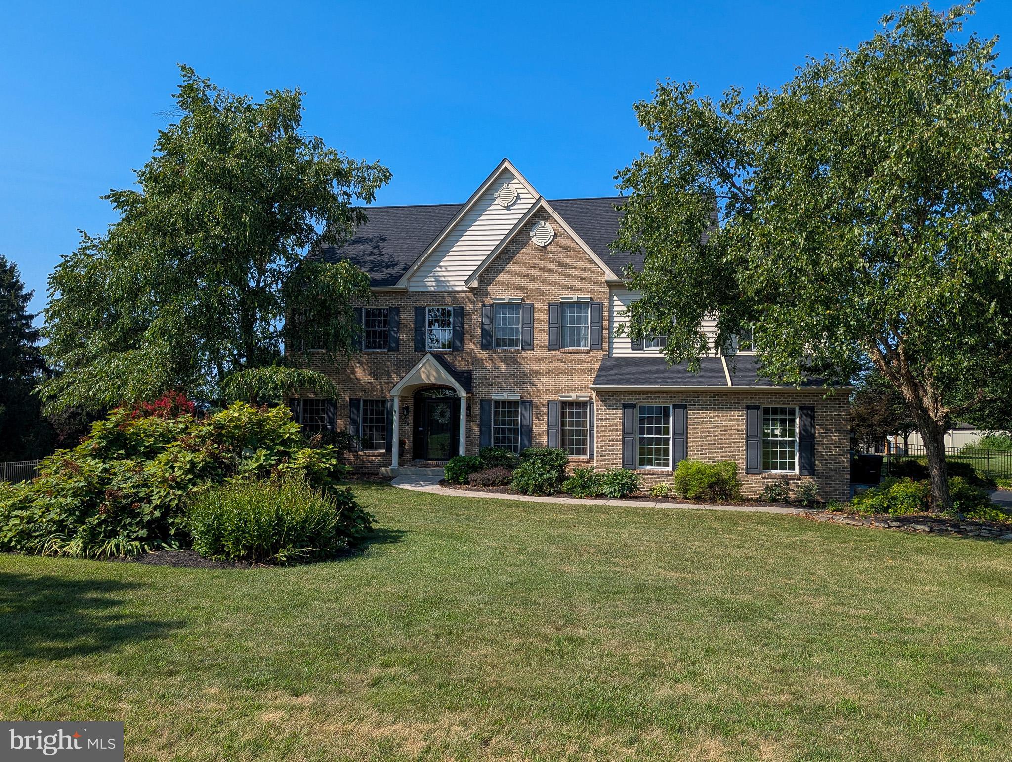 Welcome to your dream home in the heart of Skippack Township!
This impressive 4-bedroom, 2.5-bath executive residence is perfectly situated on over 1.5 serene acres in the highly sought-after Lederach Crossing neighborhood. Offering a harmonious blend of luxury, comfort, and energy efficiency, this home is designed to wow both inside and out.
Step into the grand two-story foyer and experience fine craftsmanship throughout, including gorgeous hardwood floors and custom millwork. The spacious and sun-drenched floorplan features a two-story family room, front and rear stairs, a large morning room, and a gourmet kitchen sure to delight any chef. Cozy up to one of three fireplaces, including one in the luxurious primary suite. The spa-inspired en-suite bath features a two-person soaking tub, oversized shower, and radiant heated floors.
The finished lower level offers a second family room, exercise room, and additional flexible living space. A full walk-up attic provides abundant clear-span storage or could be finished to suit your needs. A three-car side-entry garage completes the picture.
Step outside to your private resort-style backyard. Enjoy a multi-zone paver patio with a gazebo, a lush trumpet vine-covered arbor, and an extra-large and very inviting saltwater in-ground pool—heated by solar power and perfect for summer entertaining. The fully fenced backyard ensures privacy and peace of mind.
Best of all, this solar-powered home is incredibly energy efficient—the current owners have no electric bills and even sell power back to the grid!
All of this is just minutes from the shops and restaurants of historic Skippack Village, with easy access to the Rt 422 corridor and the Lansdale Turnpike entrance. In the Award-winning Perkiomen Valley School District. This one-of-a-kind home offers everything you’ve been looking for. Come see it today—you won’t want to leave!