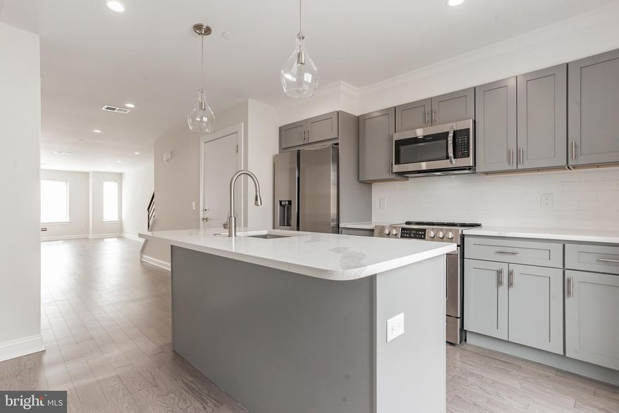 This new construction stunner built by a Premier Boutique Builder with incredible attention to detail is a must see! Live in Unit #2 of this incredible duplex located in Fishtown. Upon entering this beautiful 2 Bedroom 2 and a half bath apartment through the third floor entrance, you’ll notice a large open floor plan with lots of natural light flowing in and hardwood floors throughout. Past the living room you’ll find a powder room and linen closet which lead into the dining area and tastefully done contemporary kitchen with tons of 42 inch cabinets and self-closing drawers. The kitchen also features a large island, quartz countertops, glass backsplash and stainless steel appliances. A large glass sliding door leads you to a balcony. A custom iron railing staircase leads you to the second floor of the unit where you will find two spacious light-filled bedrooms with nice closet space, two spacious tile baths, and a laundry room. The next set of stairs leads you to the private roof deck with illuminated lighting. This unit also has access to additional storage space in the basement of the building which can be accessed from a separate entrance at the front of the building.