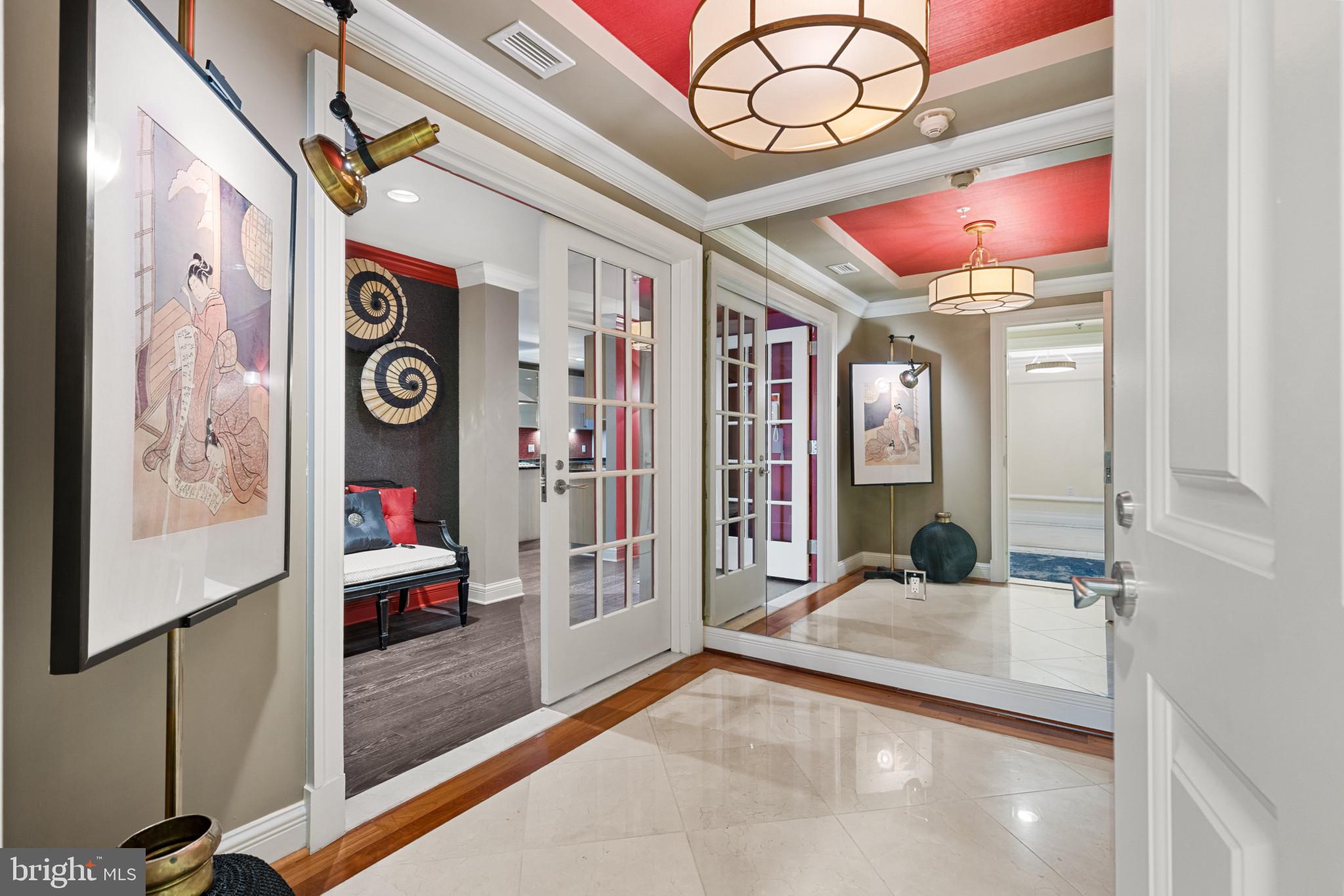 Experience unparalleled elegance at Baltimore’s prestigious waterfront community. Enter directly from the elevator into this expansive two-bedroom, two-full-bathroom, and one-half-bathroom residence which offers over 2,750 square feet of sophisticated living space, highlighted by beautiful finishes and stunning views of the pristine garden and Baltimore’s Inner Harbor. The open-concept design seamlessly blends style and functionality, with a comfortable family room off the kitchen, an elegant living room centered around the gas fireplace, and a show-stopping dining area featuring a magnificent table — perfect for hosting unforgettable gatherings. Every detail has been thoughtfully curated, from the rich designer hardwoods to the chef-inspired kitchen with Viking stainless steel appliances and custom cabinetry. The spacious primary suite boasts a luxurious spa bath and one incredible walk-in closet. Step onto your private balcony to take in the picturesque views, or unwind in your private community garden before stepping directly onto the Baltimore Promenade to hop on the water taxi or take a scenic stroll. The building’s world-class amenities include 24/7 concierge and security, valet parking, a doorman, porter service, pristine gardens, an indoor pool, a fitness center, a community theater, six guest suites, and three elegant event spaces. Minutes away from Baltimore’s vibrant arts district, as well as Ravens and Orioles games and with convenient access to BWI, I-95 South, and Penn Station, this residence provides the perfect blend of luxury, comfort, and accessibility. Discover waterfront living at its finest at The Ritz-Carlton Residences.