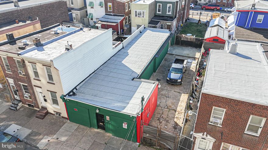 ATTENTION INVESTORS/CONTRACTORS! Garage  space with new small office/powder room,  roughed in studio apartment, additional lot on side for plenty of fenced in parking-all this with new security system. The garage is all concrete floor with plenty of drains (was previously rented as many separate garages years ago-now all one unit), newer office with powder room and A/C, potential rear apartment (buyer responsible for due diligence on zoning/usage), newer roof, and plenty of side parking. Make your appointment today!