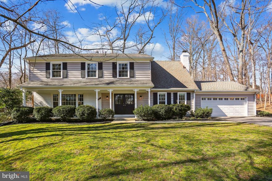 Fabulous 5BR/3.5BA brick and vinyl siding colonial with old-fashioned front porch, two-car garage, and glorious sunroom on a RARE premium 0.71-acre cul-de-sac lot in Inverness Forest located in the Churchill school district.  The floor plan boasts almost 4,000 square feet of living area on three levels. This home has been meticulously maintained and thoughtfully improved to give you a move-in ready showpiece home highlighted by a remodeled open kitchen that opens to a stunning sunroom with new LVP flooring and an inviting family room with brick fireplace. Refinished oak hardwood flooring throughout the main and upper levels, new designer stamped-pattern carpeting in the lower level, remodeled bathrooms, new custom painting, upgraded lighting fixtures, recessed lighting, skylights, newer Carolina Beaded vinyl siding and architectural shingle roof, vinyl replacement windows, and many new exterior doors. Peaceful and secluded outdoor space featuring a partially wooded lot, professionally landscaped yard with specimen trees and manicured beds of designer shrubberies, deck off sunroom, and paver/gravel stone patio with firepit feature.  Flagstone front lead walk to old-fashioned covered front porch; double-door entry doors to foyer with 18-inch marble tile flooring, two coat closets and renovated powder room; formal living room and dining room with walls of windows, detailed molding, and new chandelier; kitchen with white cabinetry, newer stainless appliances, granite countertops, recessed lighting, breakfast bar, and pass-through to sunroom; double glass French doors to magnificent sunroom with tons of natural light from cathedral ceiling, four new skylights, recessed lighting, ceiling fan, two new sliding glass doors and two sets of newer French doors leading to deck and yard; family room with brick masonry gas fireplace and new recessed lighting; mudroom off of kitchen with access to two-car garage; solid oak staircase to upper level hallway with linen closet and new lighting; primary bedroom suite with vanity dressing area, new vanity, and walk-in closet; remodeled primary bath with new LVT tile flooring, new vanity, and walk-in shower; four additional bedrooms with large closets and new lighting; remodeled ceramic tile hall bath with two new vanities, new lighting and bath fixtures; finished lower-level recreation room and media room with new stamped-pattern carpeting and recessed lighting; renovated full bath and separate utility room with painted flooring in lower level as well.  Friendly Potomac neighborhood with mature trees and lots of green space area.  Less than a mile from all three public schools in the district as well as a few private schools.  A few blocks away from Inverness Recreation Club which features a heated pool with a swim team, gated tennis and pickleball courts, a basketball/volleyball sport court, a sports field, and a playground. Shop and dine at nearby Cabin John Shopping Center, Westfield Montgomery Mall, Park Potomac, and Potomac Village.