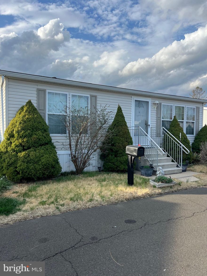 Welcome to this lovingly maintained home in the well-kept Penn Valley Terrace community.  Step inside to a spacious living area filled with natural light from multiple windows, creating a warm and inviting atmosphere. The eat-in kitchen is equipped with oak wood cabinets, GE appliances and features a charming built-in china cabinet, adding both character and storage. This home offers two bedrooms, including a generously sized main bedroom with a walk-in closet. The bathroom is spacious and features a tub for relaxation.  A convenient laundry closet includes a new LG washer and dryer. Outside, enjoy warm weather on the new wrap-around deck and the large shed offers ample storage space. Affordable living with charm and comfort, nestled in a quiet and friendly development—come see it for yourself.  Home is being sold in as-is condition.