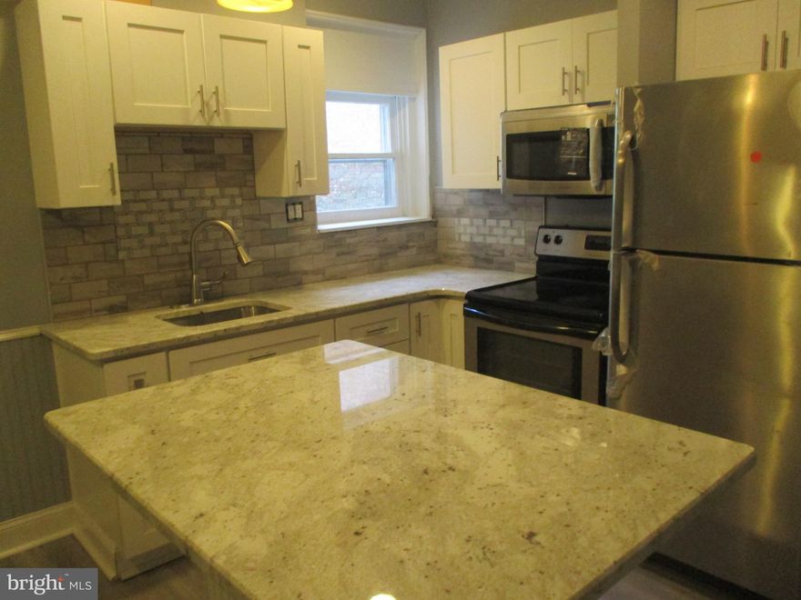 Welcome to 40 E Coulter Street! This 2 bed 1 bath bi-level unit is now available; Truly unique in the area. Located on the 2nd floor this unit has been renovated all around. Enter the unit to an open kitchen complete with updated countertops, fixtures and appliances. To the left is the updated full bathroom with a large vanity, new toilet and fixtures. Next to the bathroom is the laundry room with a hook up ready. Off the laundry room is the back deck to enjoy the back yard and scenery. The deck is perfect for entertaining guests or enjoying a cup of coffee in the mornings. Moving back inside past the kitchen is the living room area. Fully carpeted with a built-in fireplace to enjoy on a colder day. The living room is filled with natural light to create the perfect ambiance of peace and serenity. Upstairs you will find 2 large bedrooms with large closet space. 

Each room gets drenched in natural sunlight. This unit is located close to all things Germantown such as the bustling Germantown Ave, various shops, boutiques, and cafes. Close to public transportation and easy access to other areas of the city via Germantown Ave, Wayne Ave, Route 1 and Broad Street.