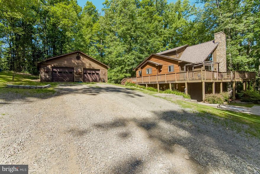 Gorgeous Chalet with 2 separate living areas. Situated on 7+ acres just outside of Warrenton, this is a perfect place to call home. 3 bedrooms, 3.5 baths, 2 kitchens, Stone fireplace in family room. Wood stove in basement. 2 separate garages. Lots of decks to enjoy the scenery. Stamped concrete patio. Wood floors, Ceramic tile baths. This home has it all. You will not be disappointed!