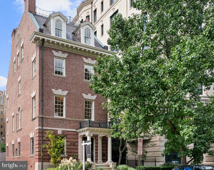 This distinguished historic residence, designed by prolific Washington architect Waddy B Wood, encompasses nearly 3,800 sqft and has three parking spaces. It features graciously proportioned rooms, welcoming living spaces and abundant sunshine. Built in 1898, this grand, freestanding home features original architectural elements such as detailed woodwork, plaster molding, deep window sills and expansive pocket doors, yet it has all the amenities and finishes needed for modern life, remote work, and easy entertaining. With two surface parking spaces, detached single-car garage, and within easy walking distance to numerous restaurants, shops, parks and the Metro, this light-filled residence offers the ultimate luxury city living experience paired with unparalleled convenience. The house has recently undergone a full top-to-bottom renovation, with entirely new plumbing, electrical, heating and cooling systems; newly-milled antique heart-pine floors throughout; new tin roof; three and a half beautiful bathrooms with Italian tile and Kohler fixtures; spacious custom kitchen; six refinished wood burning fireplaces with relined chimneys; fully restored and/or new windows and doors; designer light fixtures in every room; new garden irrigation system; and fresh interior and exterior paint. The solid construction throughout the house makes it a quiet oasis in the city. A sophisticated front vestibule with marble flooring showcases the impressive mahogany front door with custom wrought-iron detailing. A welcoming foyer opens to an elegant study and a generous family room, both of which have fireplaces. There is also a full bathroom on this floor, providing flexibility for multigenerational living. The family room opens to a beautifully-designed rear garden, which is exceptionally private and perfect for entertaining. Continue to the second level, which has nearly 10’ ceilings, oversized windows and an open-plan feel with natural flow between rooms. The stunning dining space sits naturally between the sun-filled living room and the renovated gourmet kitchen. Hidden pocket doors offer the flexibility to create a more formal dining experience. The bright and inviting kitchen features abundant storage, breakfast nook, Mouser custom cabinetry, Calacatta marble counters, Bertazzoni appliances, and a large center island. This floor also features a lovely private powder room. The upper levels provide four additional bedrooms, two full bathrooms, a library, laundry, and sizable media or playroom. The peaceful, spacious primary suite has a fireplace, impressive closet, and luxurious spa-inspired bathroom with dual vanities, frameless glass shower, and separate soaking tub. The library has floor-to-ceiling built-in bookshelves and a spectacular limestone fireplace created by two master stone carvers of the National Cathedral. All additional bedrooms capture inviting natural sunlight and have ample closet space. The loft-style top floor has an oversized skylight and dramatic demilune window with treetop views, making it the perfect home office, media room or family space, with generous additional storage. Original architect Waddy Wood designed countless residential and government buildings in the Washington area, including the Woodrow Wilson House in Kalorama, the Car Barn in Georgetown, the Department of the Interior and The National Museum of Women in the Arts. The house was constructed for prestigious geologist Arthur Keith, who lived in the house with his wife until shortly before his death in 1944. Numerous changes were made to the house over the subsequent decades, before the property was bought by the current owners in 1989 and restored to its original grandeur through a series of renovations and upgrades over the last 30 years. Their efforts have culminated with the current restoration aimed at seeing the house into the next century as one of Washington’s most impressive residences.
