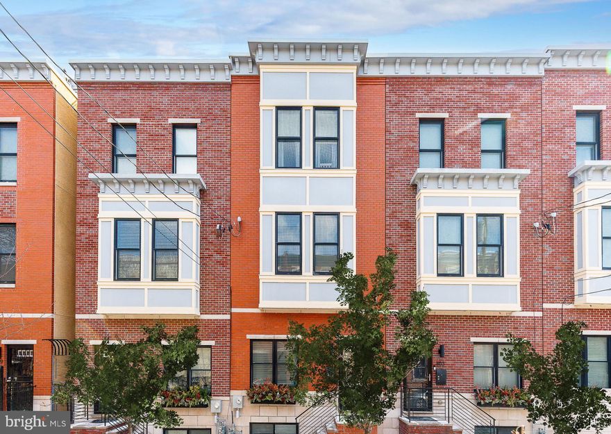 Step into a meticulously curated masterpiece at 805 N LeCount Street, a designer-owned residence that seamlessly blends bespoke luxury with the warmth of a true home. Located in the heart of Fairmount and boasting approximately two years of remaining tax abatement, this stunning 3-bedroom, 2-full, and 2-half-bath sanctuary offers an unparalleled level of detail. The main level is anchored by a chef-caliber kitchen featuring custom cabinetry that soars to the ceiling, a striking waterfall quartz island, a classic white farmhouse sink, and thoughtful functional elements like under-cabinet lighting and hidden plug molds. High ceilings and custom Roman shades throughout create an airy, sophisticated atmosphere that reflects the professional touch of its owner.

The first floor is designed for both style and utility, featuring an artistic powder room adorned with bold, brushstroke-patterned designer wallpaper and high-end lighting. Toward the rear, discover a masterfully designed back exit featuring custom black shiplap detailing and integrated coat hangers, the perfect "mudroom" transition that leads directly out to your very own private, gated parking space.

The design journey continues on the upper levels, where every room tells a story.  From the nursery’s whimsical tiger-print wallpaper to the guest bedroom's custom wood accent wall, the home is a gallery of professional design choices, including high-end chandeliers and integrated custom closet systems. The secondary bedrooms are spacious, and the second-floor guest bathroom is a gorgeous retreat with tasteful tilework and marble-topped vanities. A dedicated, organized laundry closet with custom wooden shelving adds to the home's effortless functionality. The entire third level serves as your private primary suite retreat, featuring a large, custom walk-in closet with stylish black barn doors and a spa-like bathroom complete with a dual vanity, a large glass-enclosed herringbone-tiled shower, and a deep soaking tub set against designer starburst floor tile.

The lower level serves as the ultimate entertainment hub, featuring a fully finished basement equipped with a vibrant, custom-built blue bar—complete with a dedicated wine fridge and intricate open shelving. For the ultimate city experience, head up to the expansive rooftop deck to soak in panoramic Philadelphia skyline views.

Beyond the front door, you are perfectly positioned to enjoy the very best of Fairmount. Start your mornings with a hand-crafted latte from local favorites like Musette or Brown Street Coffee, and spend your evenings at neighborhood staples such as Pier Bar or Hilltown Tavern. With the Philadelphia Museum of Art, Fairmount Park, and the Schuylkill River Trail just a short stroll away, this home offers a lifestyle of unparalleled convenience and culture. Schedule your private showing to experience this designer-curated gem for yourself!