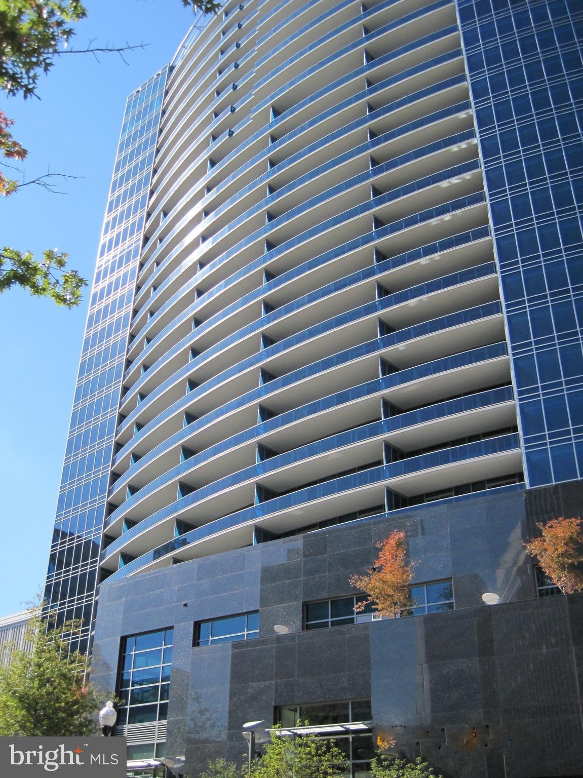 Turnberry Tower is Northern Virginia's finest and most luxurious condominium building located at the foot of Key Bridge overlooking Washington DC. Unit 2004, accessed via private elevator, is a spectacular 2655 sq. ft penthouse residence that offers a spacious living and dining area ideal for entertaining, two primary suites and a study/den/third bedroom with en-suite bathroom. Luxurious finishes include Brazilian walnut solid hardwood floors throughout, a large sumptuous marble master bathroom with separate hydrotherapy jetted tub and shower enclosure, fitted walk-in closets, remote controlled shades on all windows, SMART home automation, four wall-mounted flat screen TV s, and surround sound speakers. The kitchen features Snaidero Italian cabinetry, exotic granite countertops, Miele appliances including a 6-burner gas cooktop, convection microwave, dishwasher, wall oven, steam oven, coffee machine, wine cooler, pot filler and a Sub Zero refrigerator. A separate laundry room is fitted out with cabinets, a laundry sink and a Miele front loading washer and dryer. The residence faces west with glorious views of the Potomac and surrounding parkland and wooded areas. Magnificent sunsets can be enjoyed from the 64 ft balcony that is accessed from both the living room and bedrooms. Two assigned parking spaces and a storage unit convey. In keeping with its status as a five star residential building, Turnberry is well-staffed and residents can count on exceptional services and amenities including round-the-clock security, on-site management, doorman, valet, concierge services, a spectacular indoor pool and jacuzzi, a state-of-the-art fitness center, spa services, yoga room, media room, club room and the outdoor lobby terrace. With its superb location in the heart of Rosslyn, just moments to Georgetown, downtown Washington DC, Reagan National Airport and one block to the metro, this private oasis represents the epitome of sophisticated urban living.