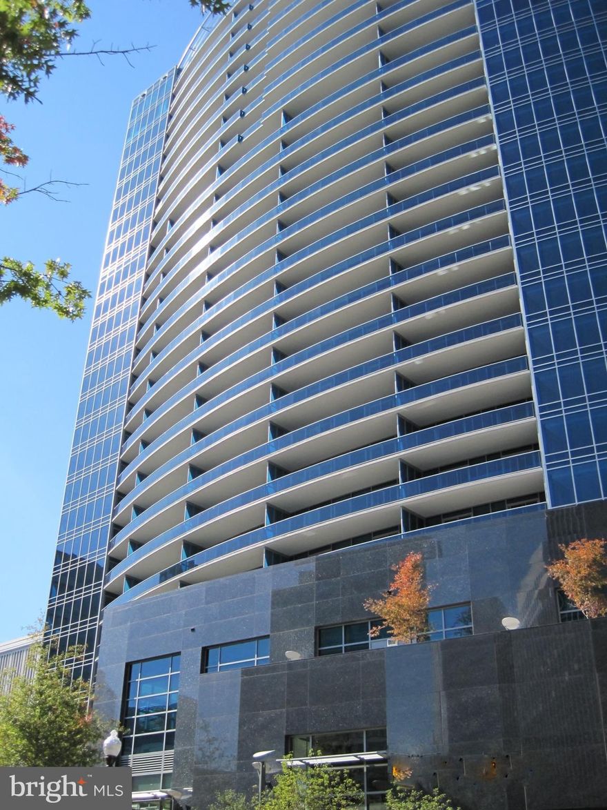 Turnberry Tower is Northern Virginia's finest and most luxurious condominium building located at the foot of Key Bridge overlooking Washington DC.  Unit 2004, accessed via private elevator, is a spectacular 2655 sq. ft penthouse residence that offers a spacious living and dining area ideal for entertaining, two primary suites and a study/den/third bedroom  with en-suite bathroom. Luxurious finishes include Brazilian walnut solid hardwood floors throughout, a large sumptuous marble master bathroom with separate hydrotherapy jetted tub and shower enclosure, fitted walk-in closets, remote controlled shades on all windows, SMART home automation, four wall-mounted flat screen TV s, and surround sound speakers.  The kitchen features Snaidero  Italian cabinetry, exotic granite countertops, Miele appliances including a 6-burner gas cooktop, convection microwave, dishwasher, wall oven, steam oven, coffee machine, wine cooler, pot filler and a Sub Zero refrigerator.  A separate laundry room is fitted out with cabinets, a laundry sink and a Miele front loading washer and dryer.  The residence faces west with glorious views of the Potomac and surrounding parkland and wooded areas.  Magnificent sunsets can be enjoyed from the 64 ft balcony that is accessed from both the living room and bedrooms.  Two assigned parking spaces and a storage unit convey.  In keeping with its status as a five star residential building, Turnberry is well-staffed and residents can count on exceptional services and amenities including round-the-clock security, on-site management, doorman, valet, concierge services, a spectacular indoor pool and jacuzzi, a state-of-the-art fitness center, spa services, yoga room, media room, club room and the outdoor lobby terrace.  With its superb location in the heart of Rosslyn, just moments to Georgetown, downtown Washington DC, Reagan National Airport and one block to the metro, this private oasis represents the epitome of sophisticated urban living.