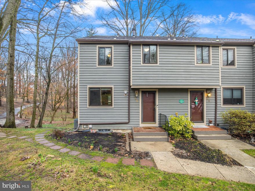 One of Towson's best kept secrets. This lovely end-of-group townhome lies within the gated community of Stone Oaks, tucked away on a well manicured piece of land that backs up to both Stoneleigh Elementary School and the Baltimore County Parks and Recreation fields and tennis courts. This upgraded townhome features open and flexible living spaces with plenty of room to entertain indoors and out. Natural light floods into the home, enhancing the elegant interior while also providing a comfortable, cozy residence. An amazing remodeled kitchen accentuated with custom wood cabinets, sparkling granite countertops, stainless appliances, tile backsplash, ceramic tile  floors, upgraded fixtures and a breakfast bar overlooks the dining/living area. Main living are has beautiful solid hardwood floors, stacked stone fireplace and access to the private rear deck. Upstairs, a large primary bedroom boasts a large closet, ceiling fan, and neutral paint and carpet.   Also on the upper level are two additional generously sized bedrooms, each with  neutral color palate and ample closet space! A lower-level recreation room  with a walk-out to the patio and backyard is the perfect spot for a playroom or possibly a 4th bedroom. Conveniently located near shopping, restaurants, local amenities and major commuter routes!  Recent updates/upgrades include, Paint, Flooring, Roof, Windows, HVAC, Water Heater, Kitchen and more  The exterior of the house is included in the condo fees, which includes the roof. Carefree living, privacy and a convenient location provide a comfortable lifestyle.