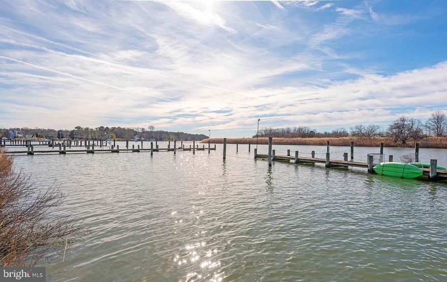 Enjoy this quiet neighborhood and be close to the water! Walk into a light and bright unit with vaulted ceilings with wood beams, enjoy the cozy wood stove in the colder months. Upper level includes the primary bedroom with en-suite. Two additional bedrooms and a hall bath completes the level. A loft is the perfect space for additional living space or home office. There is parking for one car in a garage with room to park a second car outside. Additional parking is very convenient. The community offers a pool and a clubhouse with a picnic area. Condo fees include trash, water and sewer. Close proximity to Bay Bridge. Walking distance to shopping, restaurants, and banks. Boat slips are available through the association and do not convey.