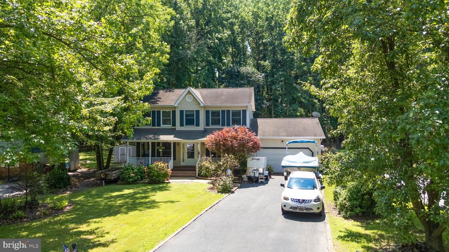 Welcome Home to This Charming Two-Story Colonial with over 2200 sq ft of living space! 

Want more than just bedroom square footage but actual entertaining space? This home is for you! Formal living  room and dining room which could be used for an office/playroom and more! Open family room, eat in kitchen and a large great room also! 

Nestled on a spacious lot backing to peaceful woods, this beautiful colonial offers over 2,200 sq ft of living space designed for comfort and functionality. A 1.5 car garage, fenced yard, and covered front porch create an inviting exterior—perfect for morning coffee or unwinding after a long day.

Inside, you'll find 3 generously sized bedrooms and 2.5 baths, including a spacious primary suite with a walk-in closet and a private en suite bathroom. The updated kitchen features Corian countertops, stainless steel appliances, custom tile backsplash, and crisp white cabinetry, all flowing seamlessly into an open breakfast nook and formal dining room—ideal for both everyday meals and special gatherings.

An oversized great room provides flexible living space with direct access to the backyard, while a cozy front living room offers the perfect spot for a home office, library, or playroom. And don't forget the family room off the kitchen for extra living space. 

As part of a vibrant waterfront community, enjoy amenities such as a pool, beach, marina, and clubhouse—with boat slips available for rent. HOA is only $200 a year for all this!! Located minutes from schools, shopping, restaurants, and with easy access to Rt. 50, this home blends charm, space, and convenience in one perfect package.

Motivated Seller and quick settlement available! Be in your new home before the holidays!