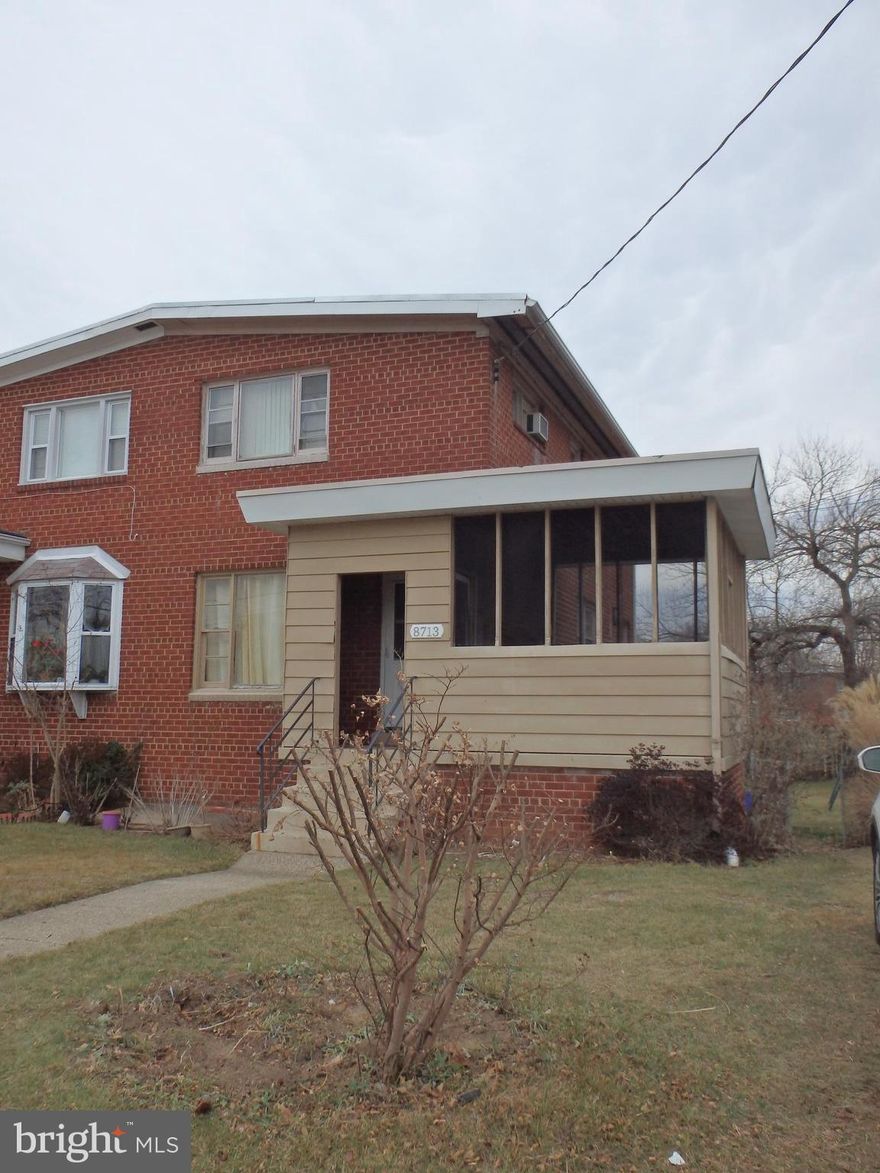 Semi-detached townhouse with off street parking screen porch and fenced back yard.