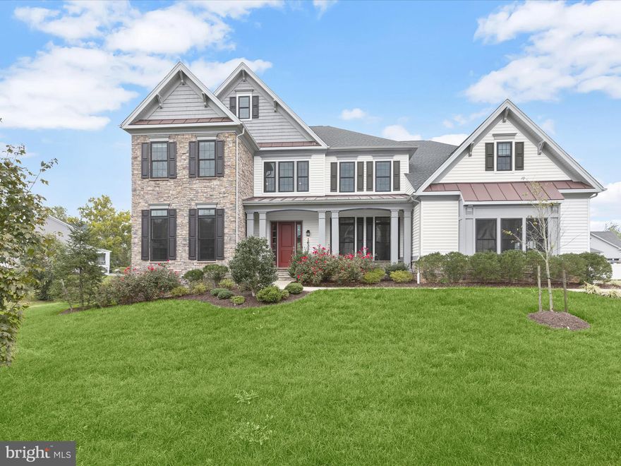 Welcome home to 1633 Grand Meadow Drive - a premiere offering in the showstopping modern farmhouse style community of The Ridings at North Branch. At nearly 9,000 total square feet, this Ridgeview model was the largest floorplan offered by Toll Brothers when built in 2019. There’s an unparalleled level of detail to the endless upgrades throughout this 5 bedroom, 4 bathroom luxury masterpiece sited on a half acre lot with a wooded backdrop. This home features ten-foot ceilings throughout the first floor and nine-foot ceilings throughout the second floor. 

The grand two-story foyer and eye-catching dual staircases immediately impress upon entry. Just beyond is the expansive family room complete with a fireplace and views of the deck and backyard. But what truly sets this home apart is the elegant main level bedroom and full bathroom just off the great room. Other main level highlights include the private study, formal dining room with extensive trim work, mudroom with built-in welcome center, and a covered patio with stone gas fireplace. The designer chef’s kitchen features best-in-class finishes like GE Monogram appliances, two-tone cabinetry, white quartz countertops, a walk-in pantry and a large center island that overlooks the sunlit breakfast area. 

The upper level presents a large landing area and spacious flex space that could serve as an additional living room, play room, game room or office area. The sprawling primary bedroom features a tray ceiling, sitting room and two enormous walk-in closets. The lavish primary bathroom presents a freestanding bathtub, huge shower stall and dual vanities. Two of the additional upstairs bedrooms share a buddy bath while the guest suite boasts its own ensuite bathroom. A generous laundry room and convenient rear staircase leading to the kitchen are also found upstairs. 

The location of The Ridings at North Branch could not be more ideal just minutes from highly-rated schools, brand-new shopping destinations and all major commuter routes. The community also features 150+ acres of green space and preserved natural areas with miles of walking trails. Undoubtedly one of the finest residences in Gambrills and one of the crown jewels of this community, 1633 Grand Meadow Drive truly transcends the ordinary.