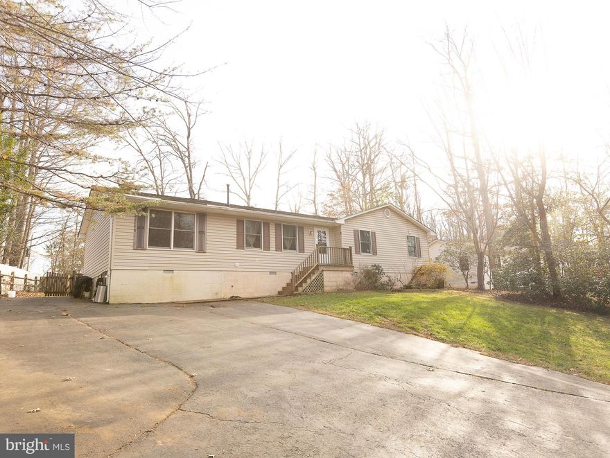 Affordable  home in the well-established, well-loved Town Creek neighborhood! This 3 bed, 2 bath rambler sits on almost a half acre at the end of a small side street. The lot is outlined with wine berry bushes and mature trees, and the fenced in back-yard offers great opportunities for kids and pets to play. Level driveway space alongside the house is well-suited for extra-large vehicles, campers, or a potential carport.

Entering the front door, you come into an open layout with the kitchen, dining room, and living room. A huge bonus room to the left can be used as a rec room space, family room, game room, or separate dining room.

On the right there is a hallway that leads to a large primary bedroom with attached full bathroom and two additional comfortably-sized bedrooms. There is a second full bath in the hall, conveniently accessible from the bedrooms and the main living space. Neighborhood has playground, tennis courts, and pool (with memberships available for purchase!)

This home has great potential and is ready for new owners to make it their own.