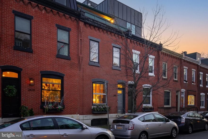 Introducing this Stunning Residence located in Center City, Philadelphia on a tree lined street in the heart of Fitler Square, within the highly rated Albert M. Greenfield School Catchment.  Step into luxury and timeless elegance with this exceptional over 2700 ft.² home featuring an ELEVATOR, providing both convenience and the ability to age in style. This home is just a few blocks from the renowned Rittenhouse Square.  The first floor welcomes you into a classic tiled vestibule while the 1st floor features original wide plank pine flooring and an Italian marble fireplace, all exuding a sense of historic charm and impressive functional space.  French doors lead from the Living Room into the spacious Dining Room. Neatly tucked between the Living Room and Dining Room is a nicely appointed powder room and coat closet. Every detail of this first floor has been carefully thought out. As you move to the kitchen you will find Stainless steel appliances, an abundance of granite countertop space and a bay window that overlooks the charming outdoor garden. The sliders lead you to the  recently renovated patio and newly landscaped gardens, all creating an ideal setting for entertaining and enjoying the outdoors. The beautiful Walnut staircase leads you to the second floor which  offers two large bedrooms (one is currently being used as an Office / Den), a tastefully updated full bathroom and a laundry room providing comfort and convenience at every turn.  Ascend to the third floor using the glass enclosed staircase. Here you will discover a magnificent Main Bedroom Suite, complete with a gas fireplace, a customized walk-in closet and a charming updated full bathroom with glass shower. Other notable features include vaulted ceilings, two skylights, sliders leading out to a spacious terrace offering breathtaking views of the Philadelphia city skyline. Looking for more space? The basement has been partially finished and previously housed a pool table making this space prime for a man cave or or kids play area. Enjoy the proximity to Schuylkill River Park, the quaint Fitler Square (with a year round farmers market) as well as the nearby Café Lutecia and Rival Brothers coffee bar. All this and more adds to the allure of this remarkable residence. With its amazing location and luxurious features, this home presents an unparalleled opportunity to embrace the best of city living in Philadelphia's prestigious Fitler Square neighborhood. Additional improvements include a new AC unit for the upper level (dual zoned) and brand new kitchen refrigerator.