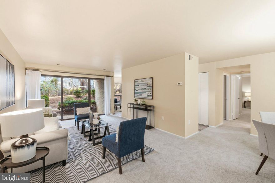 This well-maintained ground level condo offers a functional 2-bed, 2-bath layout with thoughtful updates throughout. Fresh paint and new carpeting give the home a clean, welcoming feel as soon as you step inside. The main living area is filled with natural light and opens directly to a private patio, offering easy outdoor access and a convenient connection to nearby parking and community amenities. The table-space kitchen provides ample space for casual dining and features professionally painted cabinets, granite countertops, and new stainless steel appliances. The primary bedroom is spacious enough for a king sized bed and includes a walk-in closet and its own full bath. Both bathrooms have been refreshed with new fixtures and updated finishes. The unit includes a stacked washer and dryer (installed in 2022), secure building access, and a separate storage area within the building. The condo fee includes water, and the pet friendly community (subject to association guidelines) is well suited for a ground level unit with direct walk-out access. Residents also enjoy access to a variety of community amenities, including a swimming pool, tennis courts, and picnic areas with grills, all located within close proximity. Parking is available in multiple nearby lots for convenient entry. A new HVAC system was installed in 2024. Conveniently located near shopping and dining, this move-in ready condo offers an easy, low-maintenance lifestyle. Schedule your tour today!