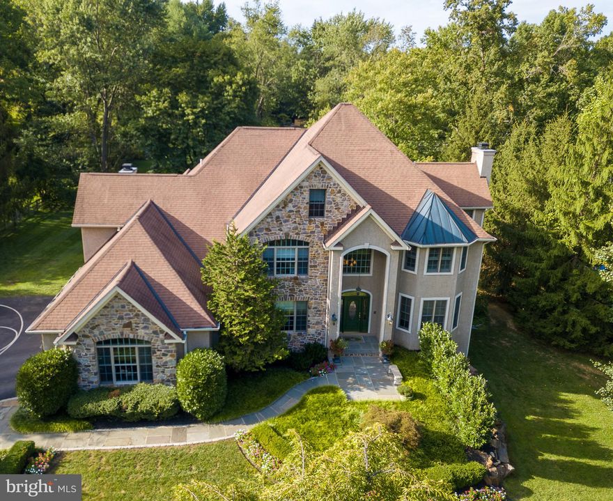 We have 3D Matterport and Video Tours available for this property! Welcome to 521 Sugartown Road - a spectacular custom stone colonial home offering 5 bedrooms and 5.1 bathrooms situated on a magnificent one acre lot in the heart of Devon and Top-Rated Tredyffrin-Easttown School District. Architectural features and exquisite detail abound in this elegant home such as extensive millwork and wainscoting, keystone peaked archways, rounded wall corners, and transom and oval windows. The grand entrance of this breathtaking home offers a dramatic two-story foyer with a sweeping staircase and gleaming mahogany hardwood flooring. From the formal living room to the spacious dining room with attached parlor/sunroom with marble surround gas fireplace, this home is an entertainer's dream!  The large and upgraded gourmet kitchen with attached breakfast room opens to the focal point of the home - the two-story great room - featuring rustic wood ceiling trusses and a floor-to-ceiling stone wood burning fireplace with an impressive wood mantle. The main level is completed with a professional style office with cherry built-ins and wainscoting, a powder room, and the recently expanded mudroom with five built-in lockers, cherry hutch/desk, charging station, and cabinets.  The second level offers an incredible master bedroom suite with sitting area with gas fireplace; master bathroom with his and her vanities, soaking tub, and large stall shower; and a massive walk-in closet with built-ins and vanity/make-up area.  Three additional bedrooms all with large closets and two full bathrooms, complete the second floor. The third level of this amazing home features a fifth bedroom with high ceilings, walk in closets with built-in cabinetry, and a full bathroom. The finished, walk-out basement is bright and open and offers an additional bedroom/bonus room, full bathroom and a recently updated laundry area with two sets of washers and dryers, sink area with cabinetry and custom shelving.  The professionally landscaped grounds of this property are not to be missed - enhanced stone and slate entrances and walkways, high-end lighting, estate gate and fencing, and amazing outdoor living spaces.  Featuring an expansive slate patio, cedar pergola, and upper deck connecting to the great room and breakfast room- indoor/outdoor entertaining has never been so easy! Close to Devon Yard, the Devon Horse Show, minutes to downtown Wayne with it s amazing array of dining and shopping options, minutes to the Paoli train station, and convenient to all major roadways for an easy commute to Philadelphia and Wilmington.  This home is not to be missed! Check out the Matterport tour: https://my.matterport.com/show/?m=6U2KHjVK42b&mls=1.       For Our Open Houses: We will be following safe showing protocol - all agents and visitors must sign in and wear masks and gloves, only one group permitted inside at a time, 15 minute increments,  - Thank you and please be patient as we navigate this new Open House process!