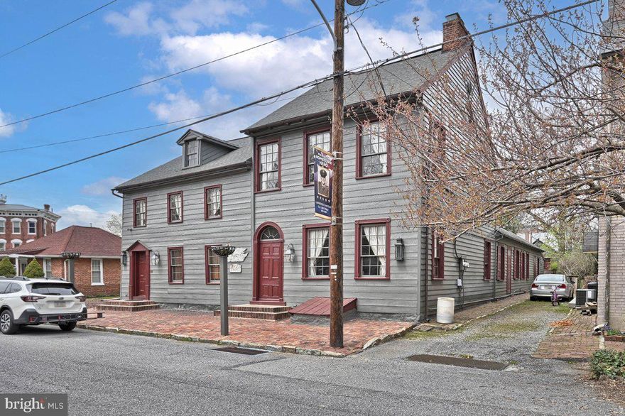 Marietta living at it's best!  Welcome home to "The White Swan" , a beautiful property nestled in the town of Marietta. Original house built between 1765-1810, over the centuries this property has served as an inn/tavern, a pub,  and private residence. This charming  property has a lot to offer. Some of the features include a pub, gourmet kitchen with brick and stone floors, custom cabinetry, wainscoting, a walk-in fireplace, parlor, multiple dining rooms, 3 bedrooms and 2 full baths and a massive attic area. Other features are a beautifully landscaped courtyard, a carriage house and detached garage. 
The interior shows lovely restored hardwood flooring in the first floor and original hardwood on the 2nd floor, original wainscoting and log wall in the keeping room outside the parlor, original built-in cabinets and woodwork throughout most of the home. The White Swan has been featured on Marietta's candlelight tour and is a local landmark. Close to the rail trail and Susquehanna River, shopping, local pubs and more, this home is a must-see!
Don't miss out on the opportunity to own a piece of history. Call to make an appointment to see this home!