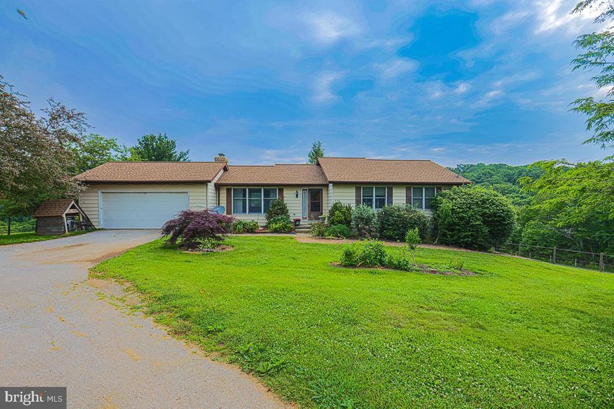 25,000$ !!!! closing help OR use towards interest rate buy down!!  Ask me how!  Take advantage of this HUGE incentive from the sellers!!!
 ///  **view the video!**  ///  **  Great Property &  Income Producing **  Beautiful quiet horse farm in the outskirts of Westminster city .  Literally minutes from Westminster Main Street and very close to the PA line off Rt 97, yet far enough away where it is secluded and serene.  This modest adorable Rancher comes with a second unit in the lower level (basement) to promote additional income or use as an in-law suite!  The second unit could bring in 1800$ plus AND you could rent a stall and use the top field for horse boarding collecting 500$ plus a month!!  The second unit space is a one bedroom with full bathroom, kitchen, and it's own access!  Main level will benefit with a little updating however it has been cared for so very well.  It has three very nice sized bedrooms.  A window view from the kitchen of the farm and horses.  One full bath in hallway and a full bath in the primary.  Working fireplace and large deck off the back to watch those peaceful night skies and look over the beautiful land that is yours!  Roof, HVAC, well system & septic all updated with in last 3- 5 years,

The property is 11 acres pasture and 10 acres wooded.  The woods can generate income too...filled with mature Oak and Maple worth a lot of money!!  Many sources of extra income to be had!!!  
There is a beautiful pond full of bass and a running stream for your farm animals.  The Trails of Union Mills are a 2 min horse ride away...great for hiking too! Another fun fact...the property allows for ANOTHER HOME (dwelling) CAN BE BUILT for family! That is a big deal!  The barn is very updated and well taken care of.  Stalls for (4) and a Foaling area and Tack Room.  Run In Sheds and there are  (4) fields to turn out and rotate if needed.  The land flows with slight rolling hills and the home sits on a higher level.   There are neighboring homes, however far enough away that you feel secluded but close enough to make friends if you desire.  21 acres and Country living is beautiful and a dream of many...make it yours!  As Is sale