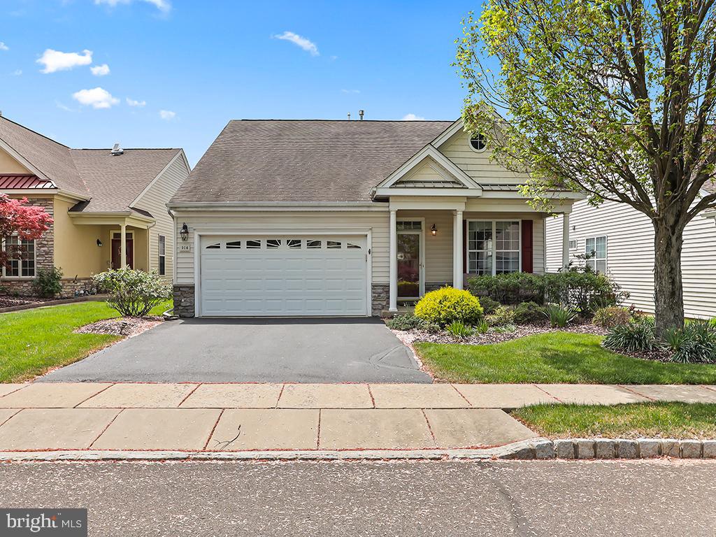Welcome to 914 Harrison Lane in the highly sought-after adult community of Heritage Creek Estates in Bucks County! This beautiful 2 bedroom, 2 bathroom home features a covered front patio, two-car garage, and meticulously maintained landscaping. This Franklin model enjoys first floor living, an expansive open floor plan, and stunning decorative crown molding throughout the home. The spacious living room and dining room seamlessly blend, perfect for hosting friends and family. The kitchen boasts beautiful wood cabinets, a large island, and a sun-soaked breakfast area. The kitchen opens into the family room, which features a charming gas fireplace with custom built-in shelving, and recessed lighting. The relaxing primary bedroom features a generous walk-in closet and en-suite bathroom with a walk-in shower, deep soaking tub, and double vanity. This home also includes a roomy second bedroom and a full bathroom. The laundry room off of the garage, includes the washer/dryer, utility sink, and a dedicated storage closet. Access your backyard and additional private patio through sliding glass doors in the breakfast area, perfect for enjoying the outdoors. The club house is only a short walk away to a welcoming space to play cards, host events, connect with neighbors, and more. Enjoy an indoor swimming pool, outdoor swimming pool, tennis courts, bocce ball, and shuffleboard. The HOA takes care of lawn care, mulching, snow removal, and trash. Don't miss out on this incredible opportunity to live in one of the most desirable layouts in Heritage Creek!